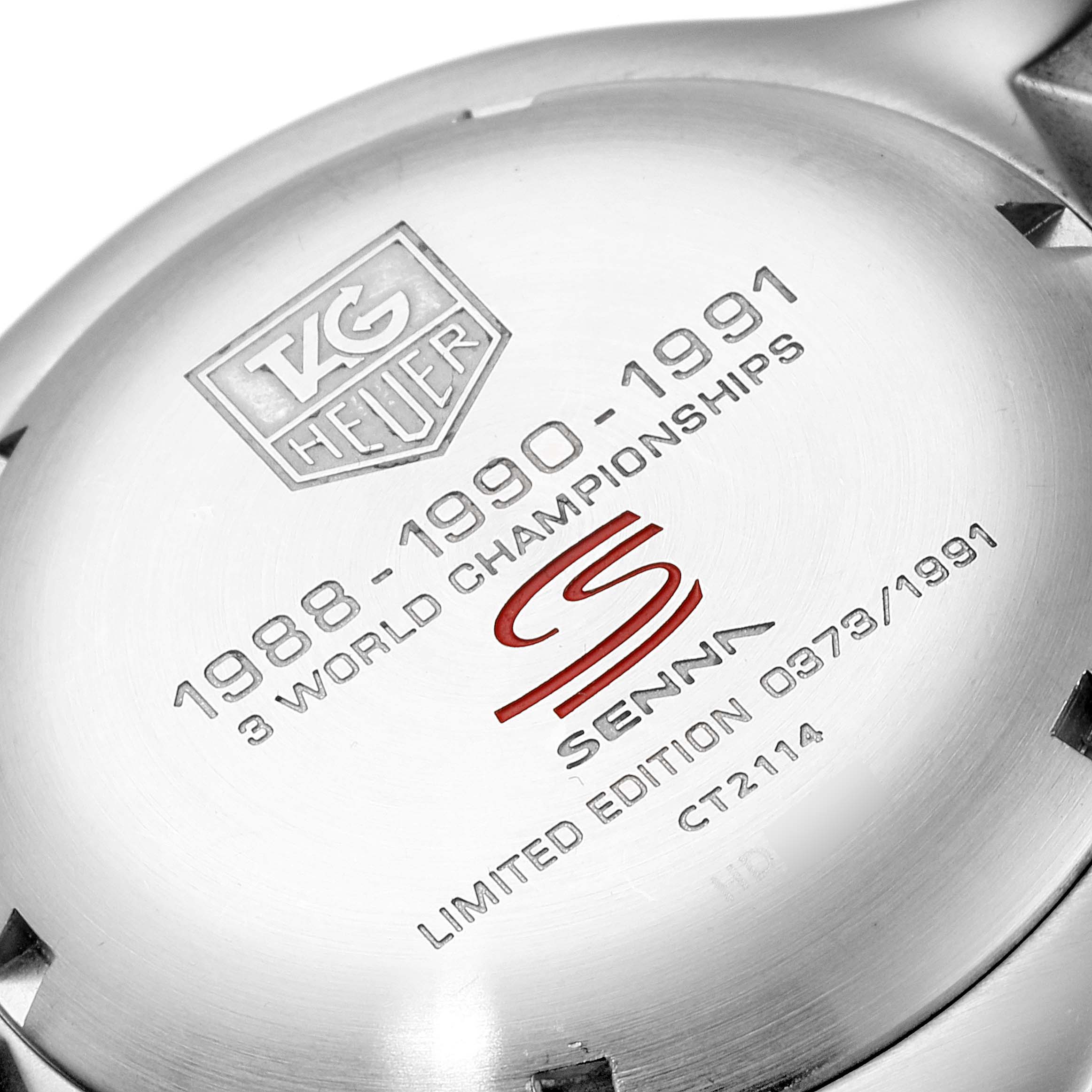 This image shows the engraved back case of a Tag Heuer Link CT2114 Men's Stainless Steel Black Dial CT2114 Men's Stainless Steel Black Dial model watch.