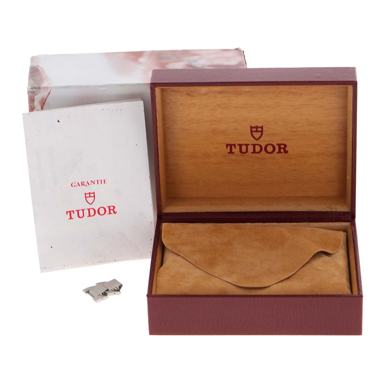 The image shows a Tudor Prince 79180 Men's Stainless Steel Silver Dial 79180 Men's Stainless Steel Silver Dial model watch box, pillow, guarantee card, and a metal link.