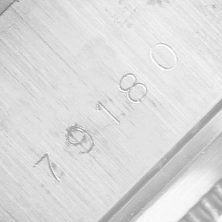 This image shows a close-up of the case side with the serial number of a Tudor Prince 79180 Men's Stainless Steel Silver Dial 79180 Men's Stainless Steel Silver Dial model watch.