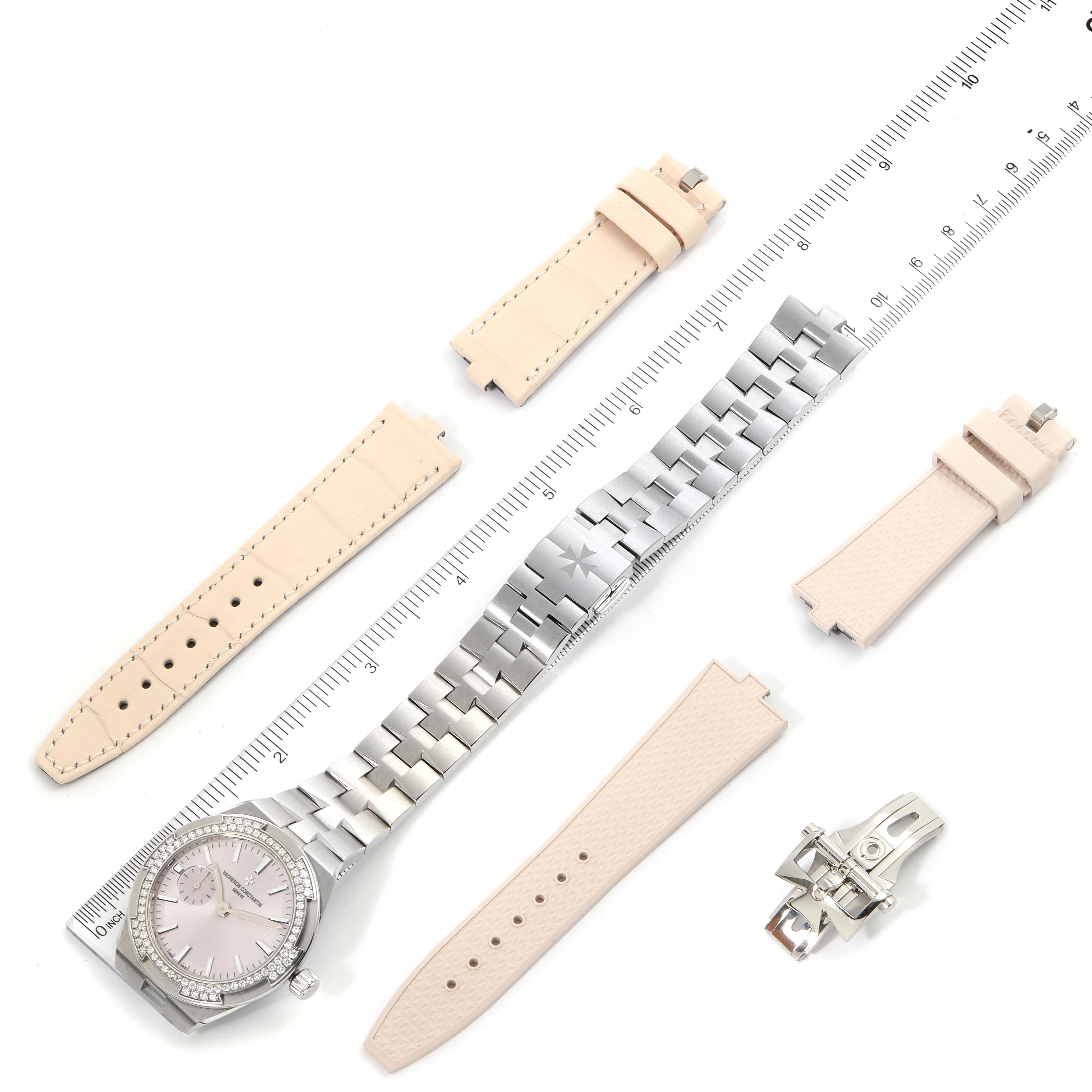 The image shows a Vacheron Constantin Overseas 2305V/100A-B078 Women's Stainless Steel Pink Dial 2305V/100A-B078 Women's Stainless Steel Pink Dial watch with interchangeable straps and a clasp viewed from a top-down angle.