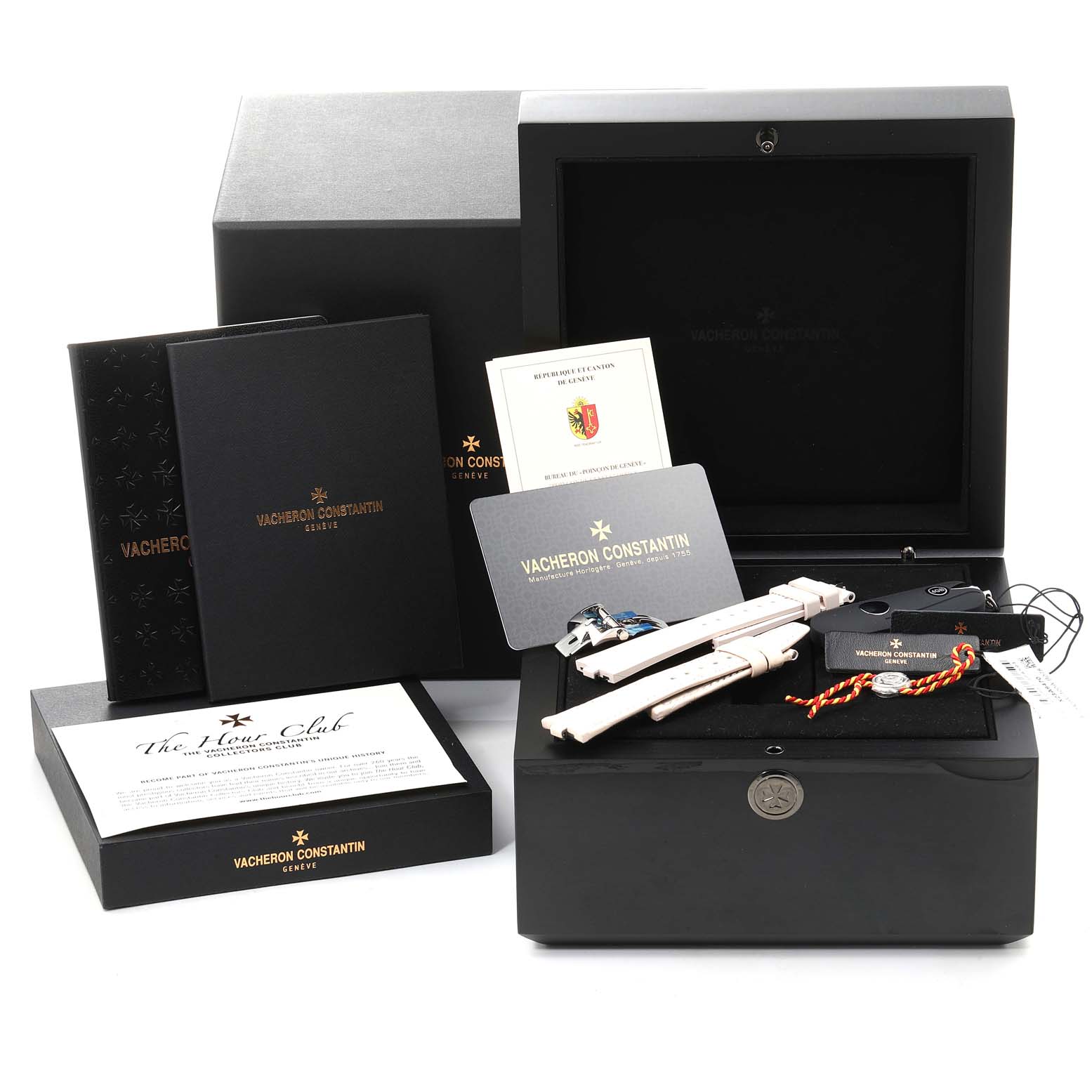 The image shows the accessories and packaging for the Vacheron Constantin Overseas 2305V/100A-B078 Women's Stainless Steel Pink Dial 2305V/100A-B078 Women's Stainless Steel Pink Dial model, including documents, straps, and a presentation box.