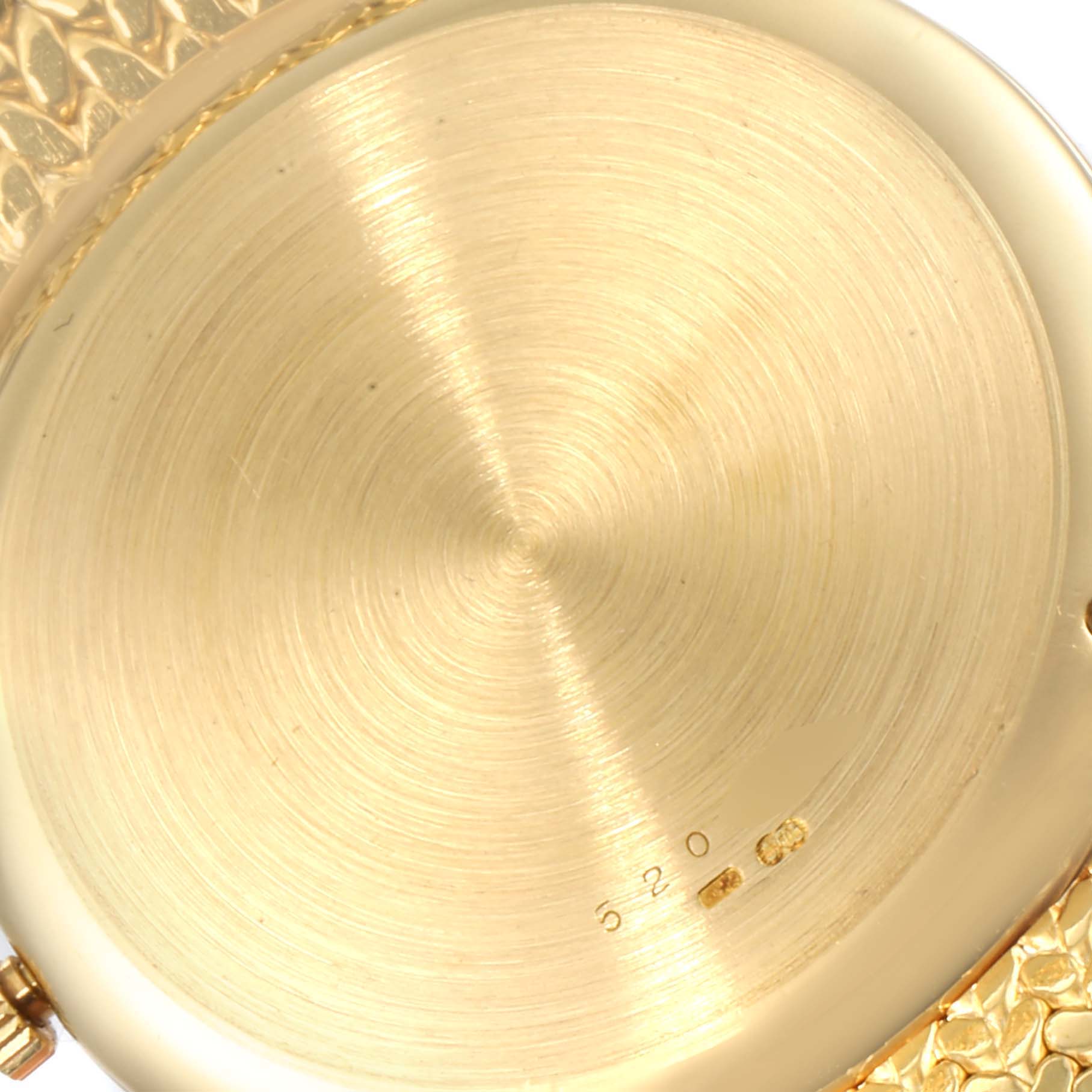 The image shows the back case of a Vacheron Constantin Patrimony 44012 Men
s Yellow Gold Champagne Dial 44012 Men
s Yellow Gold Champagne Dial watch from a close-up angle.