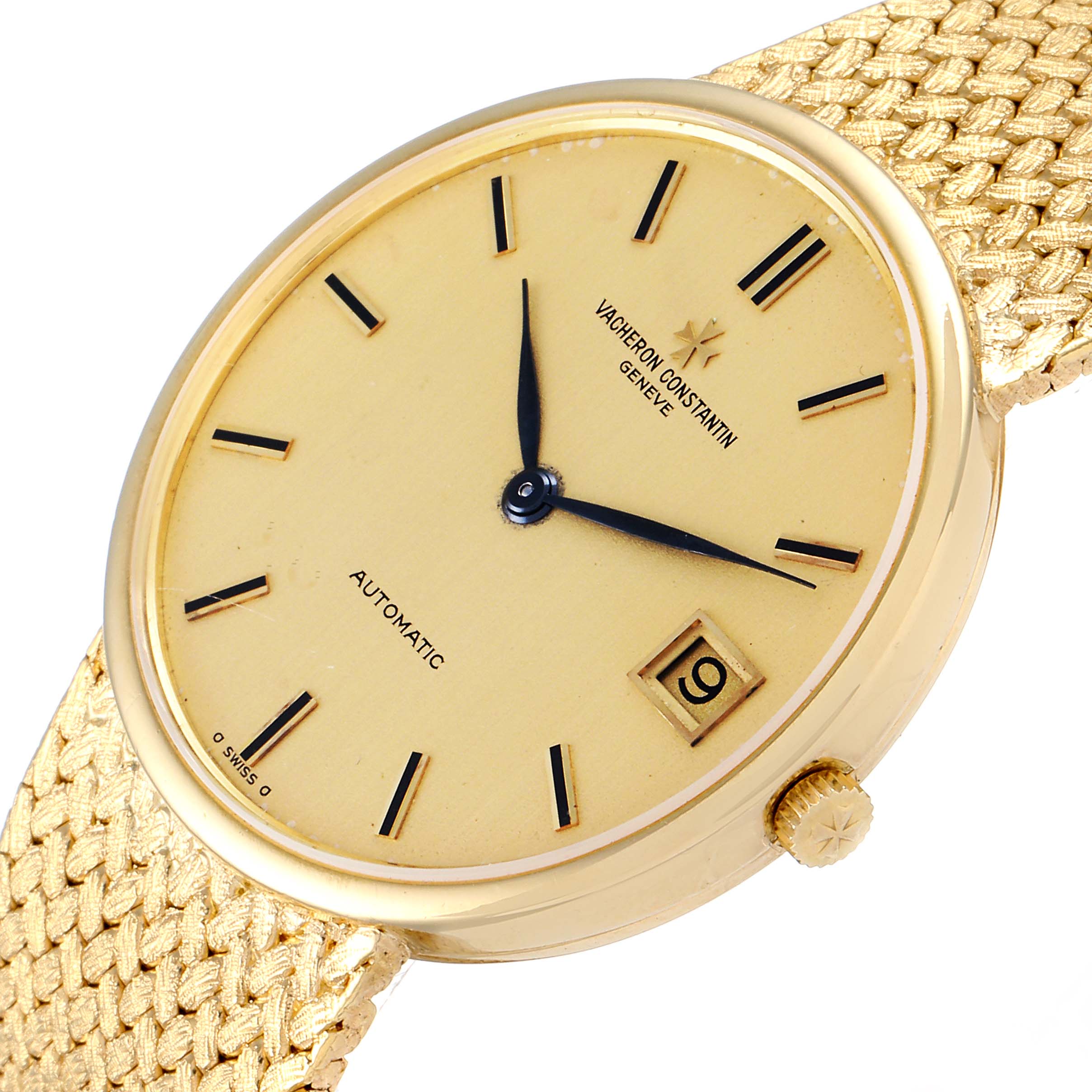 This image shows a Vacheron Constantin Patrimony 44012 Men
s Yellow Gold Champagne Dial 44012 Men
s Yellow Gold Champagne Dial watch at an oblique angle, highlighting its gold dial, hands, date window, and textured gold strap.