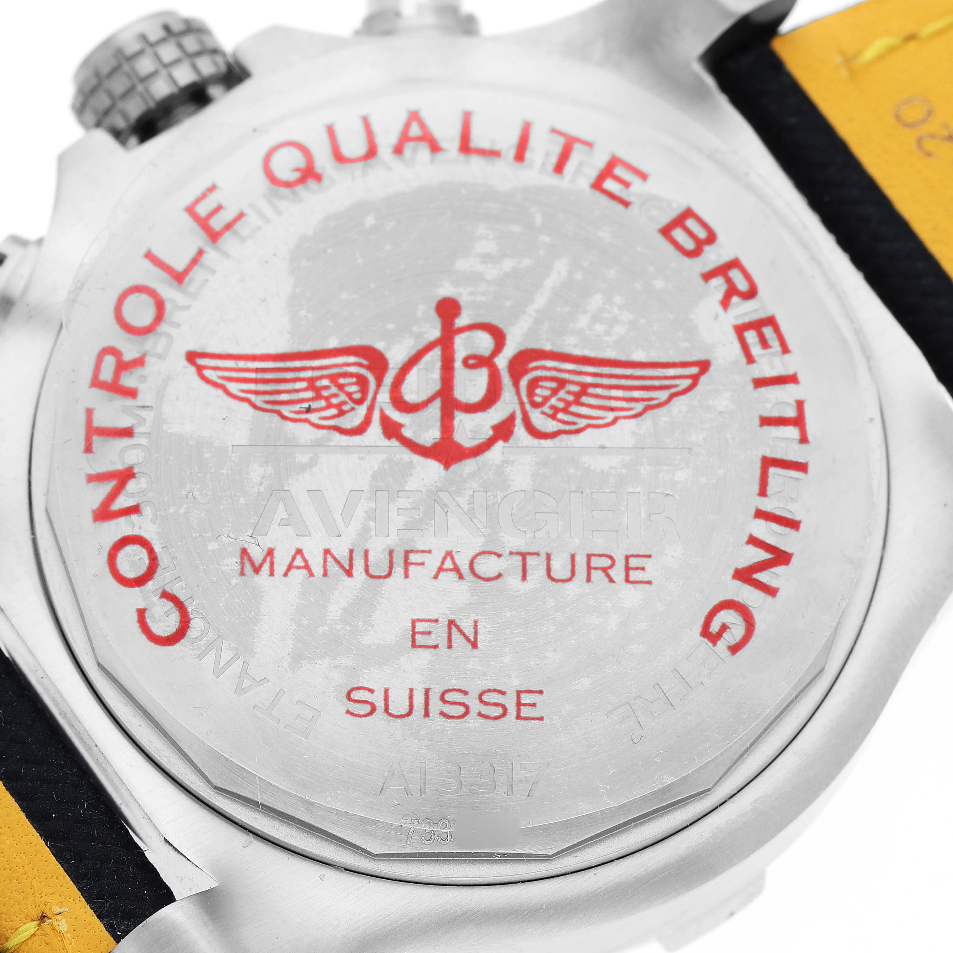 The image shows the back case of a Breitling Avenger A13317 Men's Stainless Steel Blue Dial watch, featuring branding and manufacturing information.