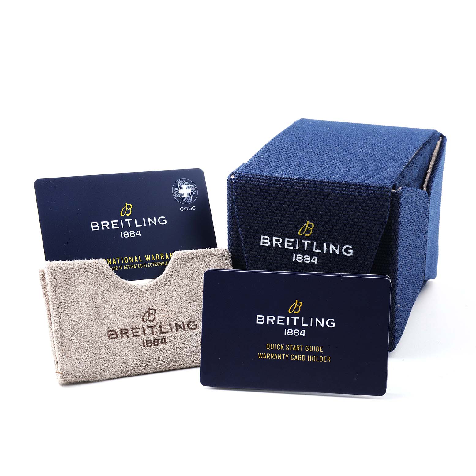 The image shows a box, warranty cards, and a cardholder for the Breitling Avenger A24315 Men's Stainless Steel Blue Dial watch.