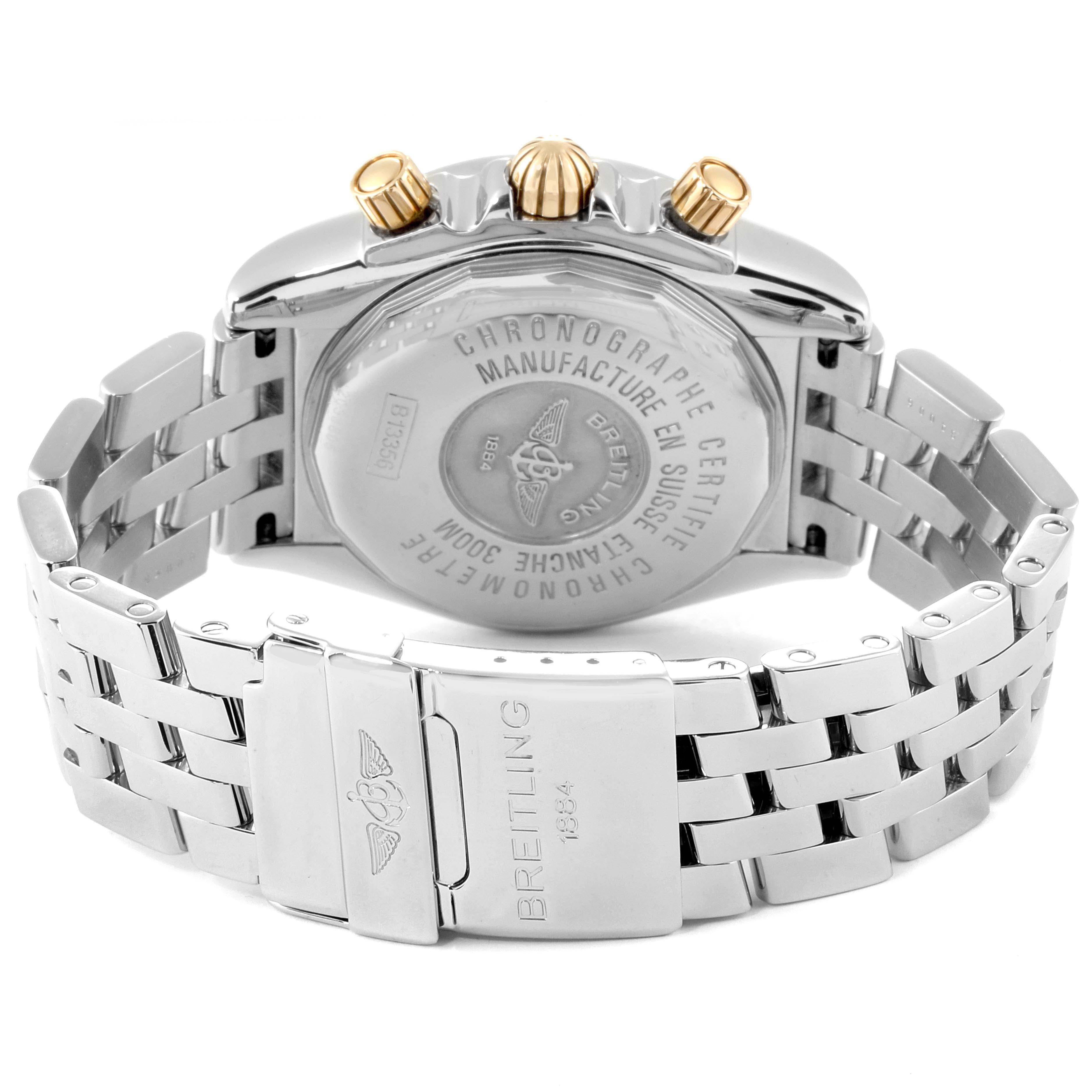 The image shows the back case and bracelet of a Breitling Chronomat B13356 Men's Steel and Gold (two tone) Black Dial B13356 Men's Steel and Gold (two tone) Black Dial watch, highlighting the engravings and clasp.
