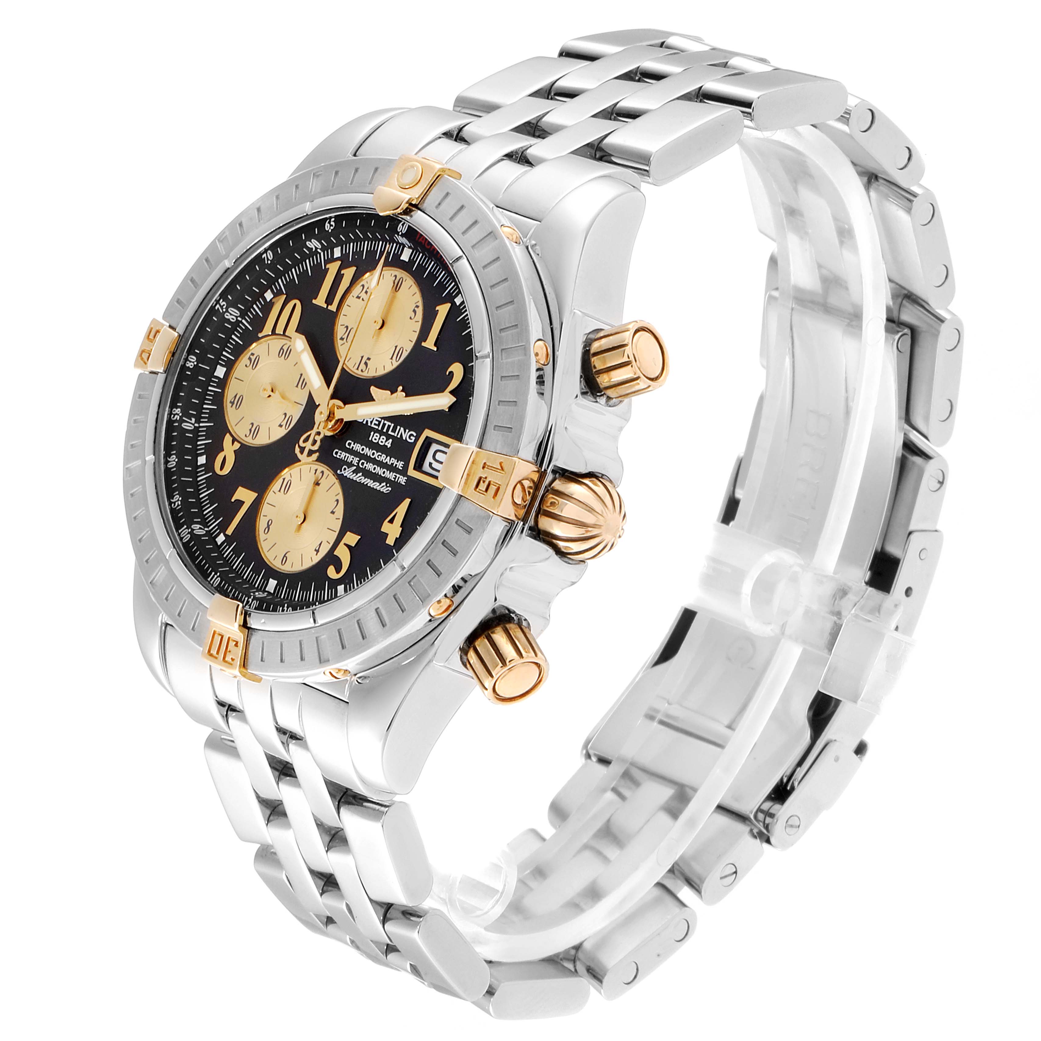 The image shows a Breitling Chronomat B13356 Men's Steel and Gold (two tone) Black Dial B13356 Men's Steel and Gold (two tone) Black Dial watch at a three-quarter angle, highlighting the case, bezel, face, and stainless steel band.