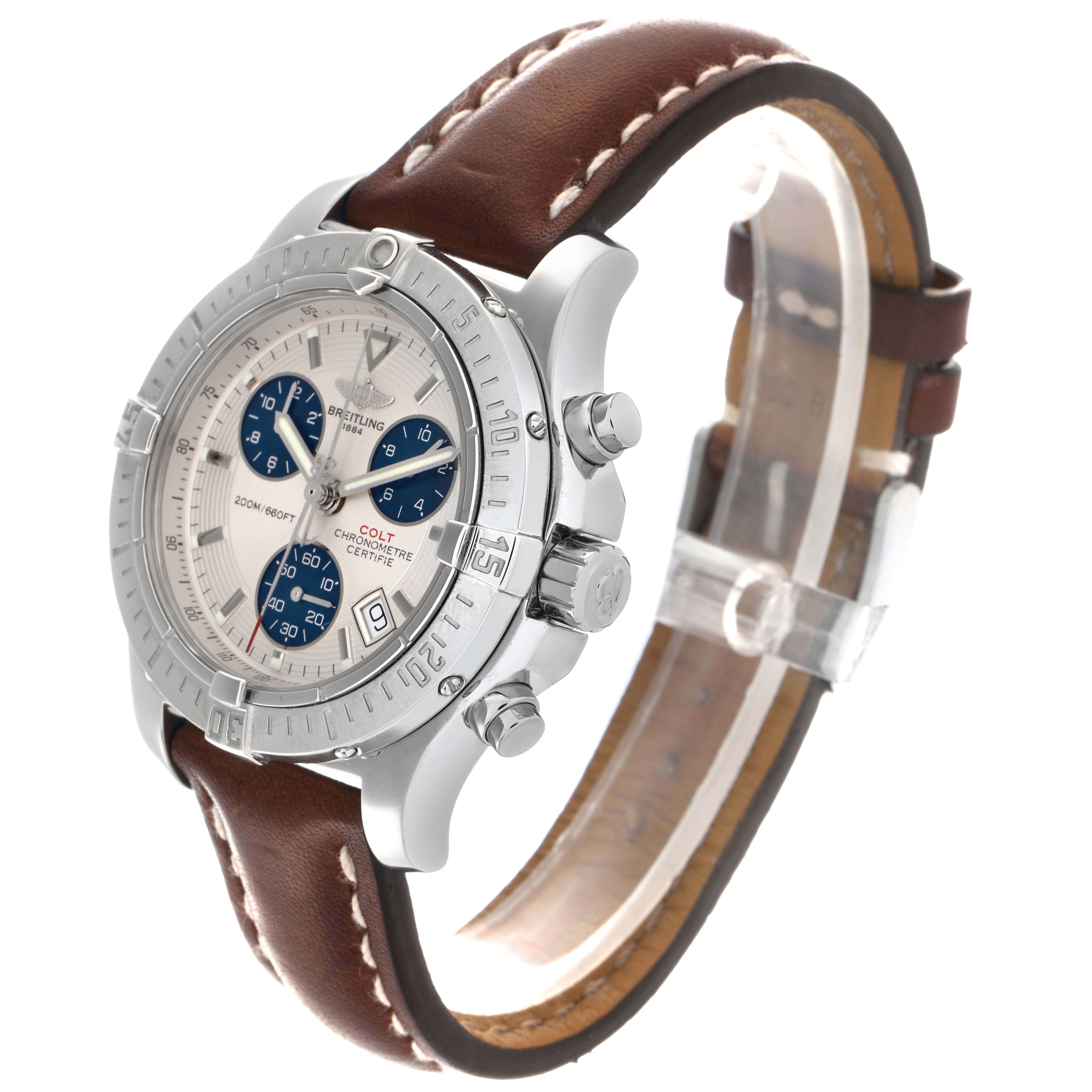 The Breitling Colt A73380 Men's Stainless Steel Silver Dial A73380 Men's Stainless Steel Silver Dial watch is shown at a three-quarter angle, highlighting the face, bezel, crown, and brown leather strap.