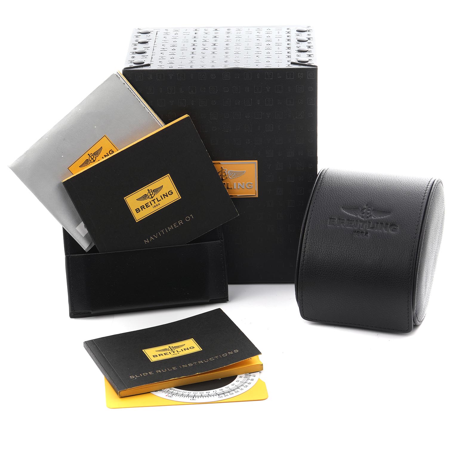 The image shows a Breitling Navitimer AB0120 Men's Stainless Steel Black Dial AB0120 Men's Stainless Steel Black Dial watch box, manuals, and a circular leather pouch at an angled view.
