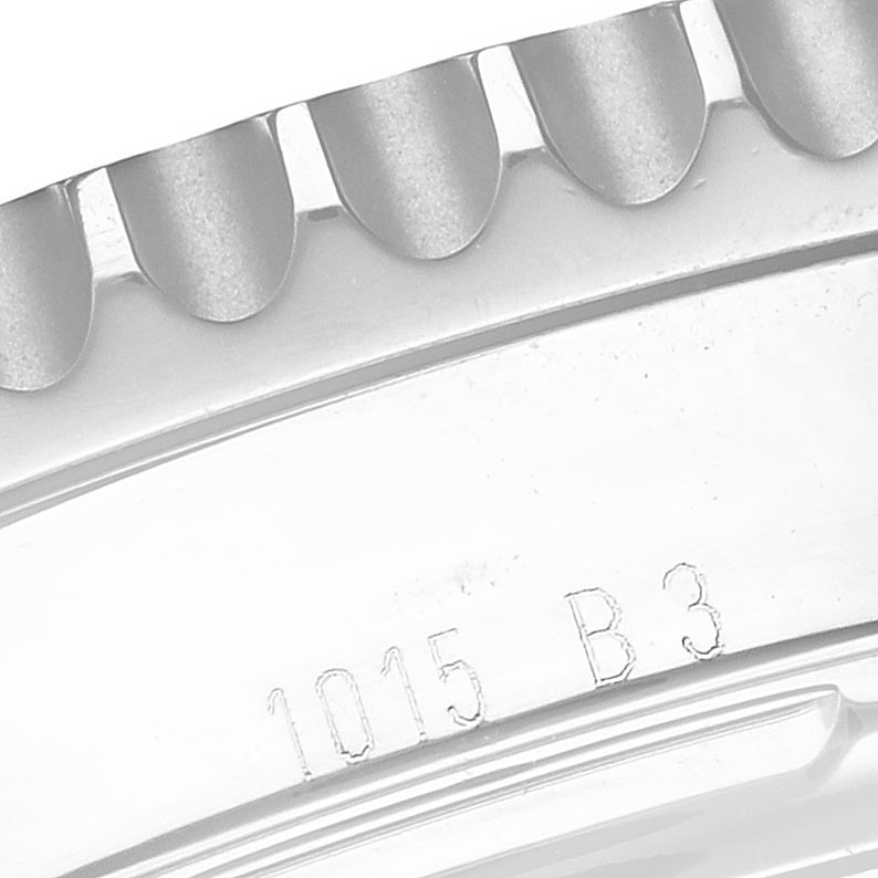 The image shows a close-up of the engraved case side and bezel teeth of a Breitling Navitimer AB0120 Men's Stainless Steel Black Dial AB0120 Men's Stainless Steel Black Dial.