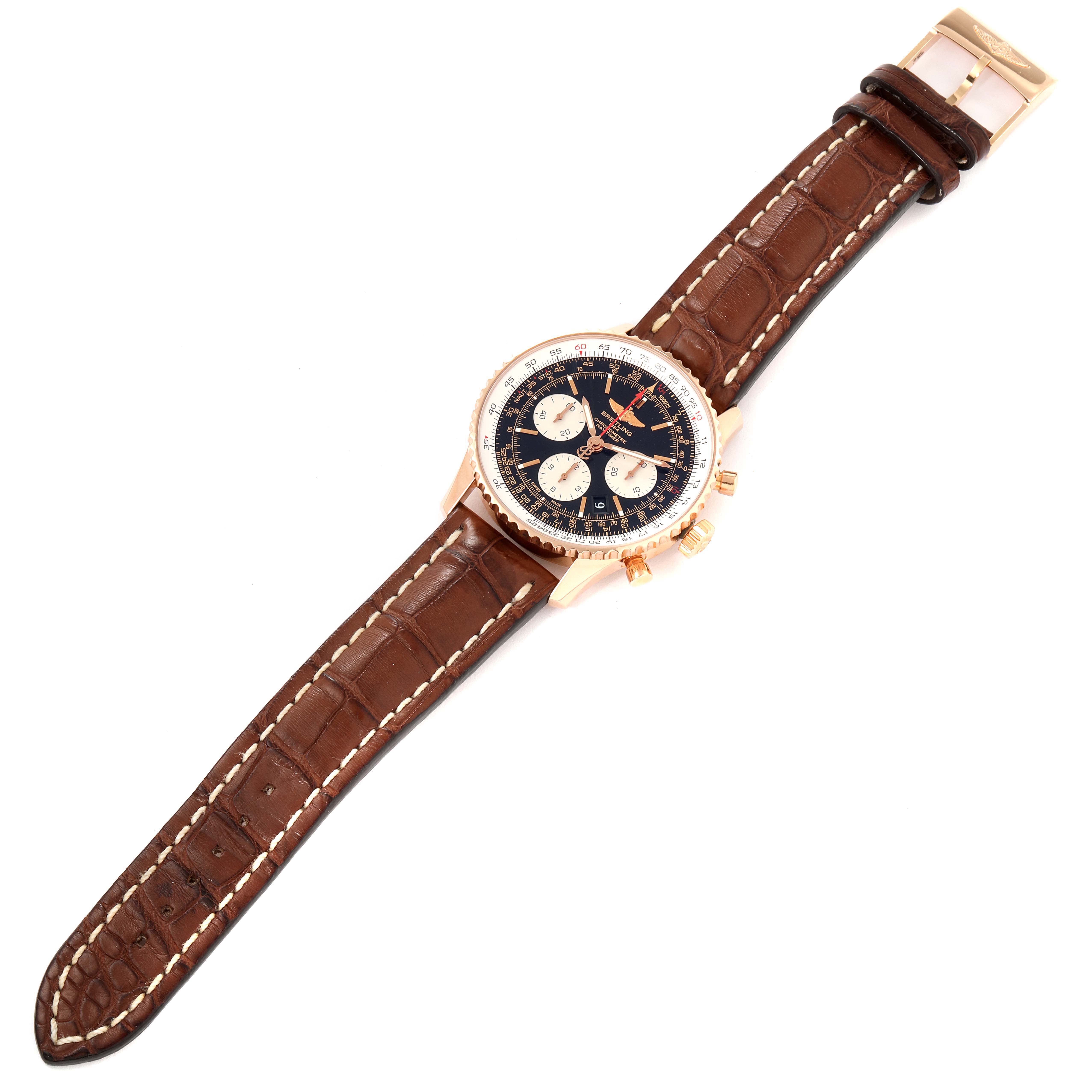 This image shows the Breitling Navitimer RB0120 Men's Rose Gold Black Dial RB0120 Men's Rose Gold Black Dial watch laid flat with a brown leather strap, showcasing its dial, bezel, and side buttons.
