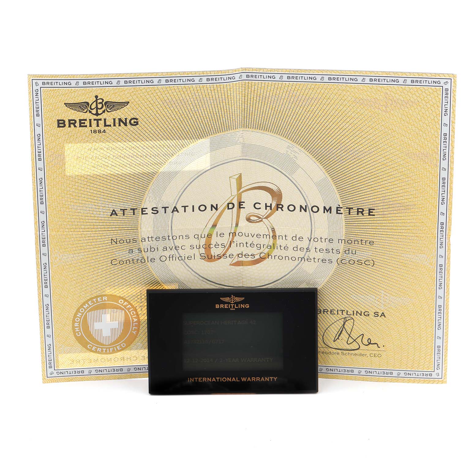 The image shows a Breitling Superocean A17321 Men's Stainless Steel Silver Dial A17321 Men's Stainless Steel Silver Dial warranty card and chronometer certificate, presented from a front angle.