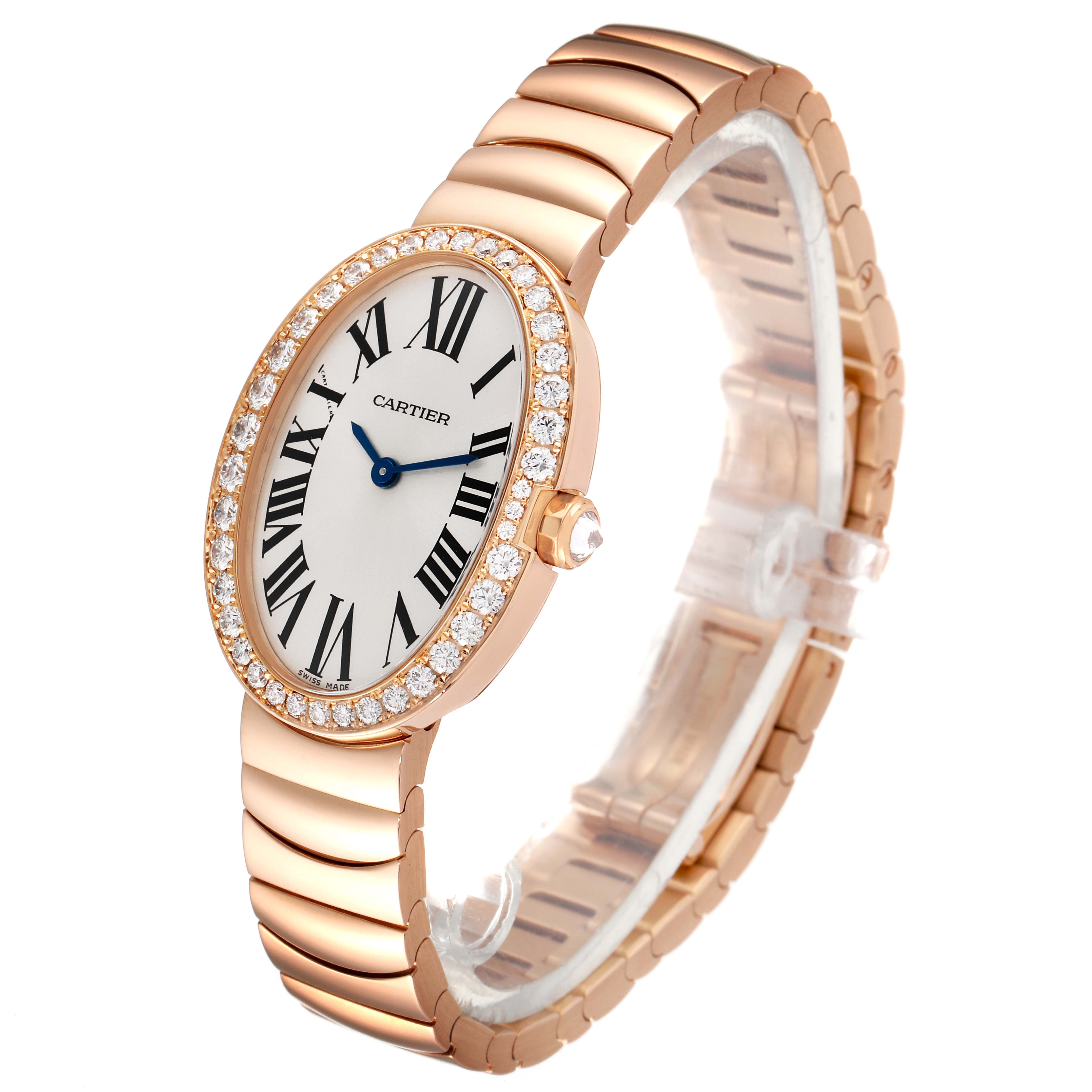 The image shows a side-angle view of the Cartier Baignoire WB520002 Women's Rose Gold Silver Dial WB520002 Women's Rose Gold Silver Dial watch, featuring its oval face, diamond bezel, and rose gold bracelet.