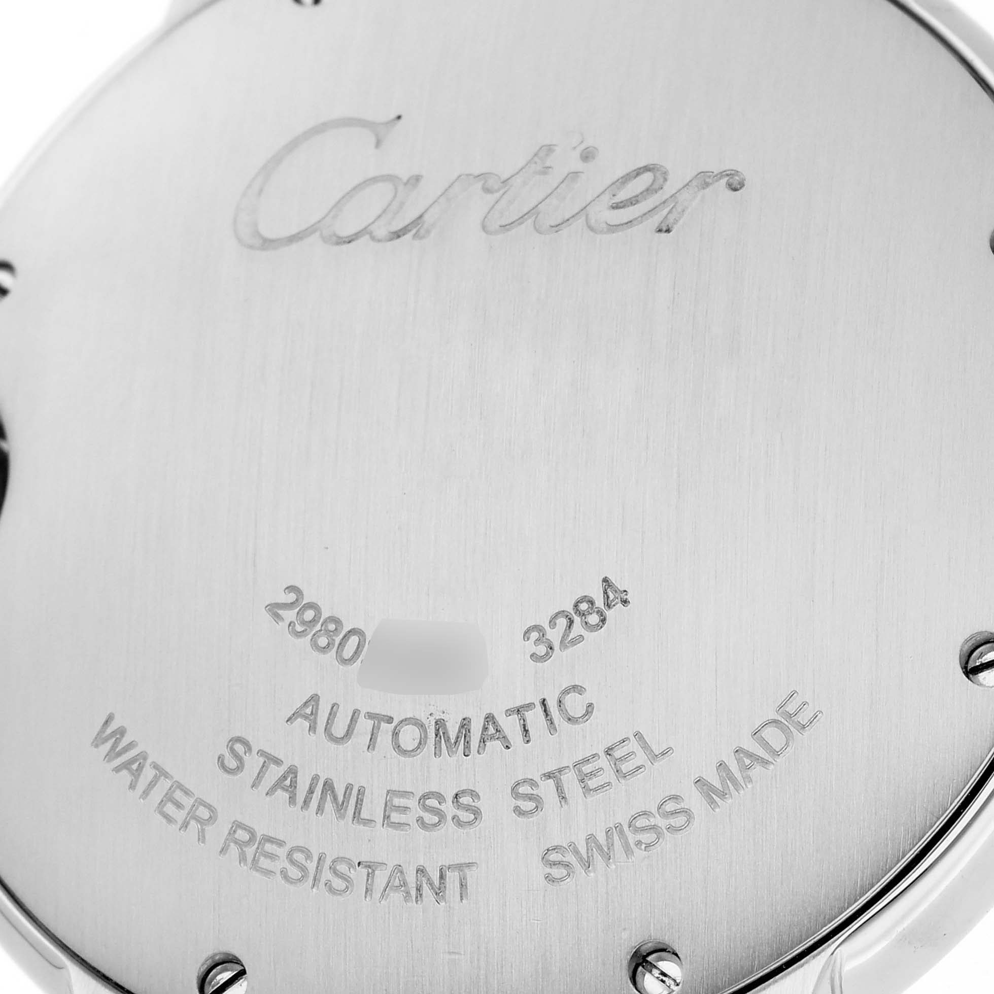 This image shows the back case of a Ballon Bleu watch by Cartier, highlighting the brand, serial number, and specifications.