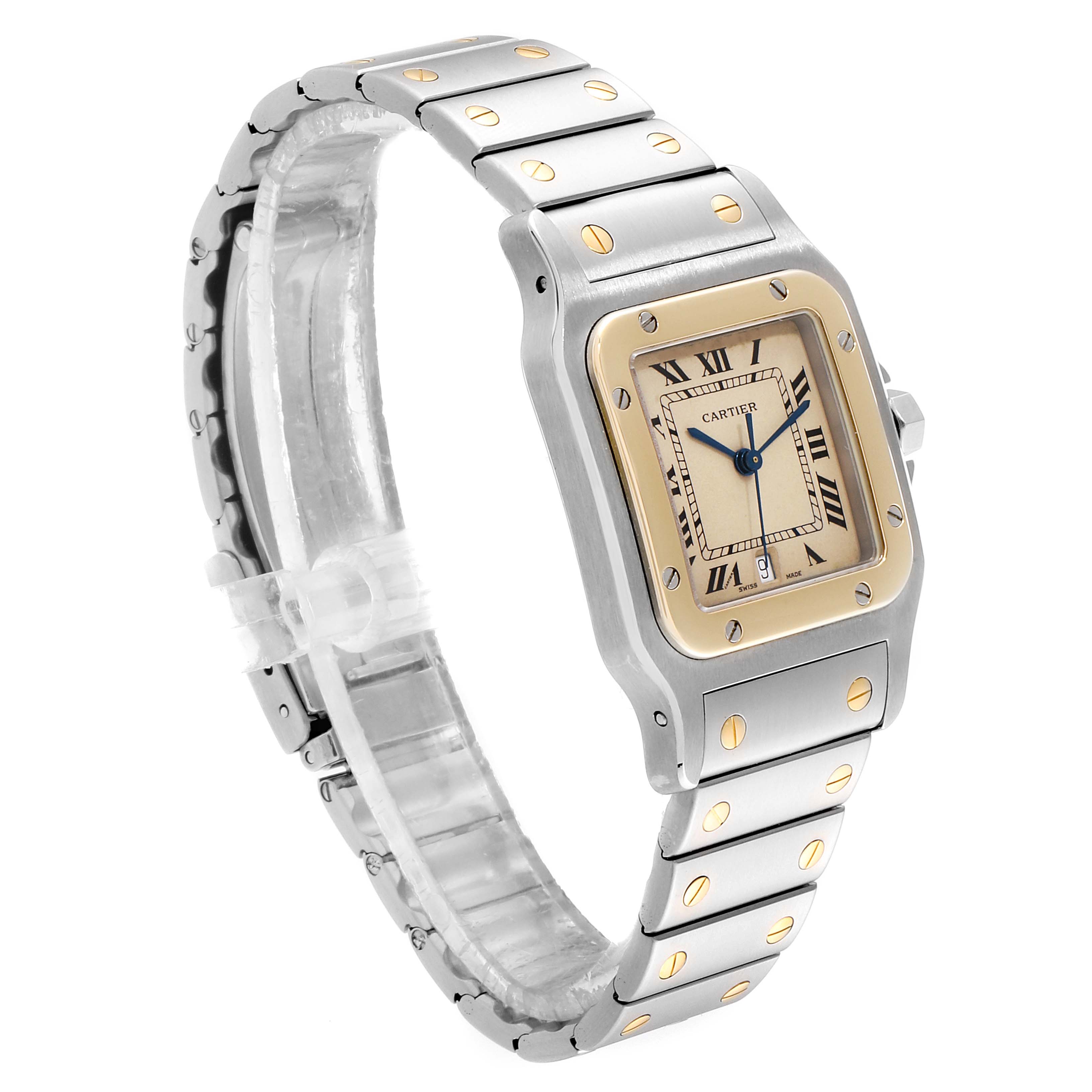 The Cartier Santos 187901 Men
s Steel and Gold (two tone) Beige Dial 187901 Men
s Steel and Gold (two tone) Beige Dial watch is shown at a three-quarter angle, highlighting its face, bezel, and metal strap with gold screws.