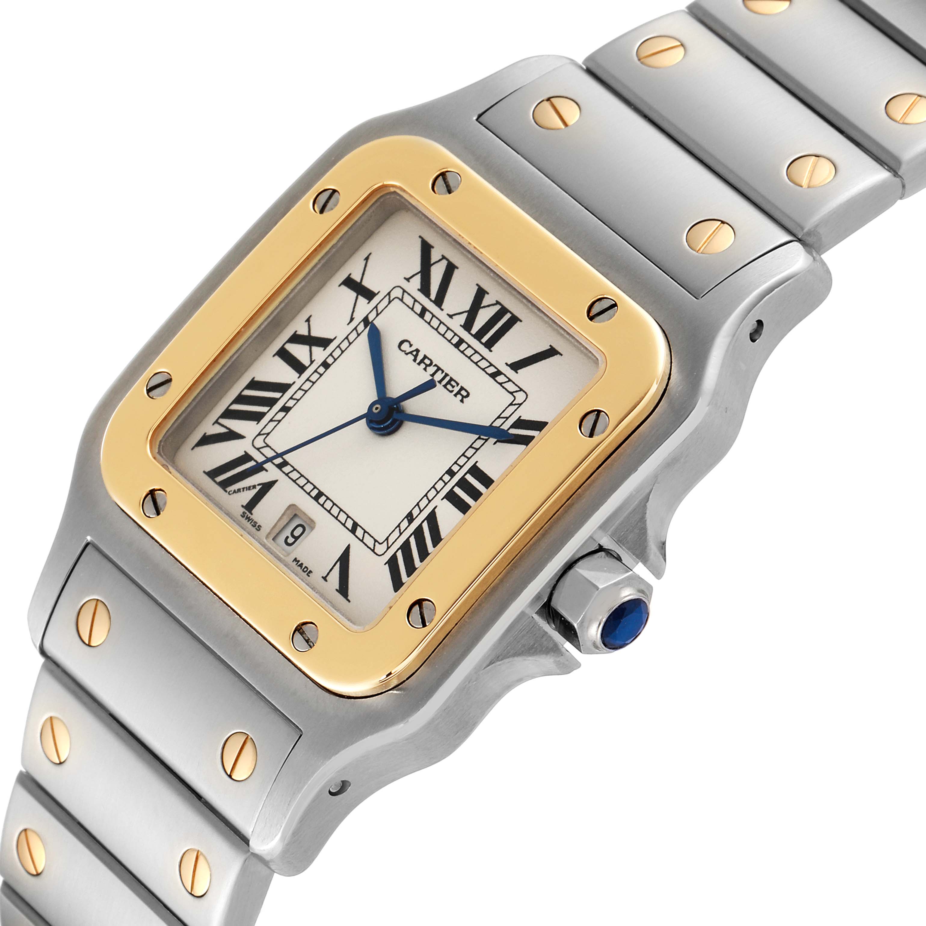 This image shows a close-up of the Santos model watch by Cartier, focusing on the dial, bezel, and part of the bracelet.