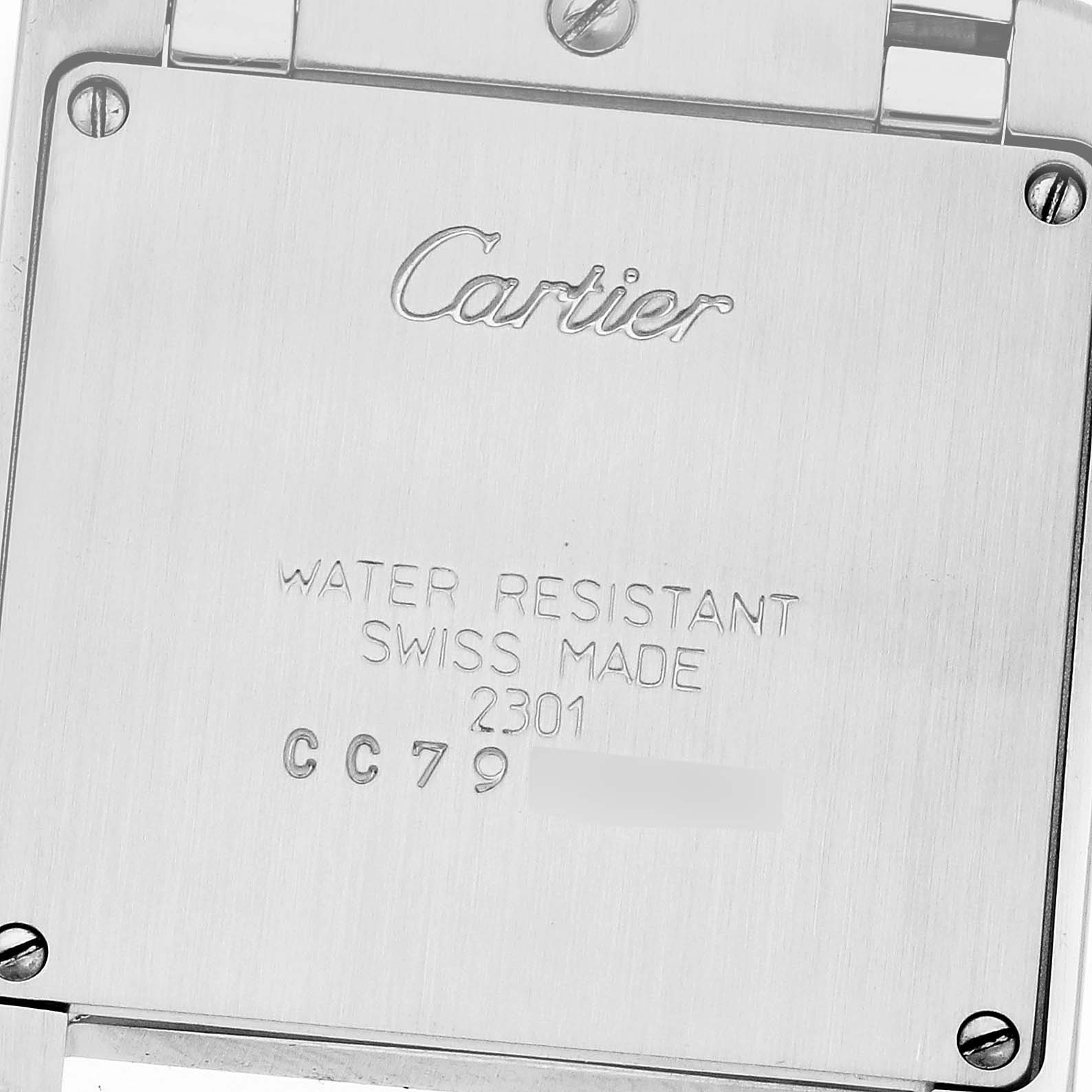 The image shows the back case of a Cartier Tank Francaise W2TA0003 Women
s Steel and Gold (two tone) Silver Dial W2TA0003 Women
s Steel and Gold (two tone) Silver Dial watch, displaying engravings and screws.