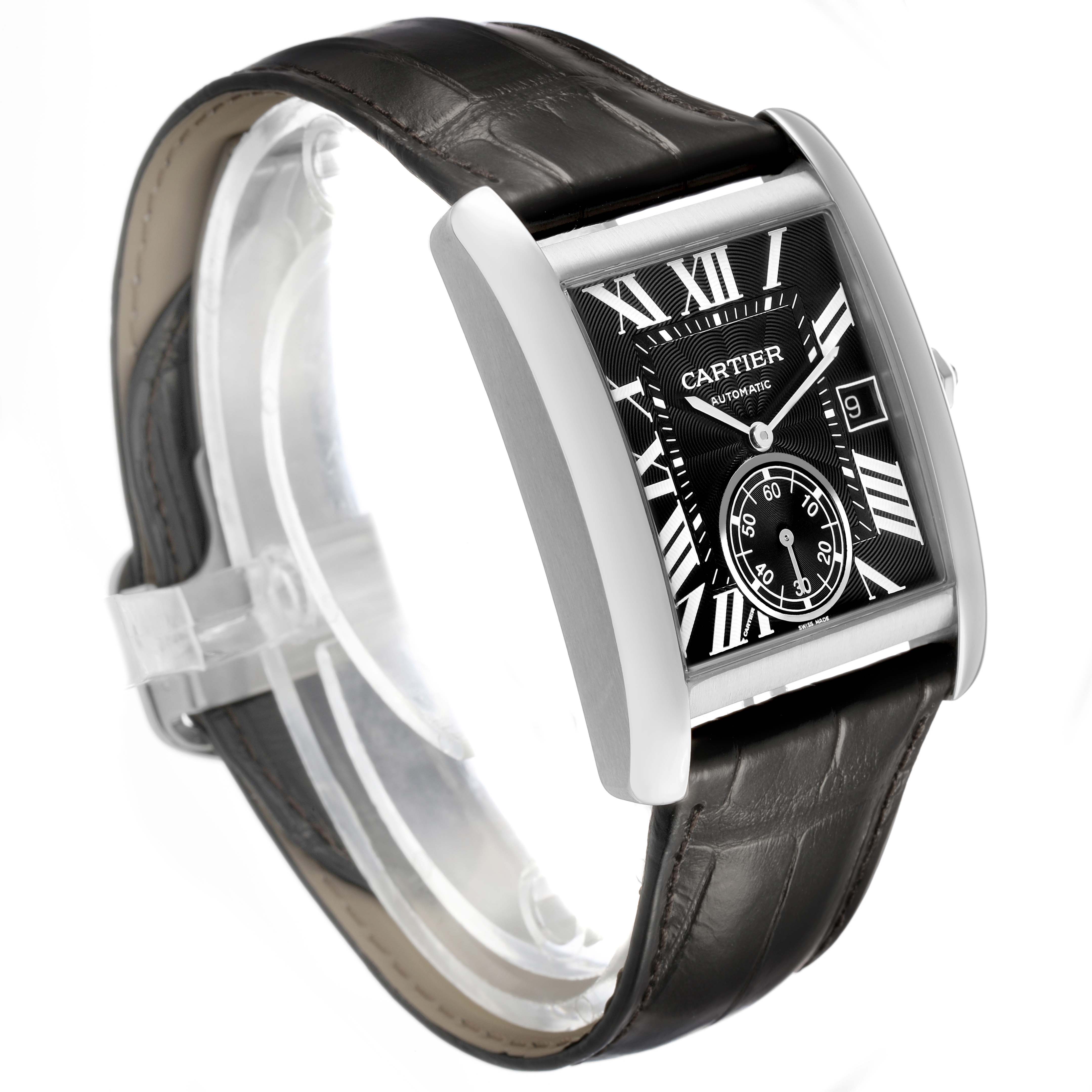 The Cartier Tank MC W5330004 Men's Stainless Steel Black Dial watch is shown at an angled side view, displaying the black dial, Roman numerals, subdial, and leather strap.