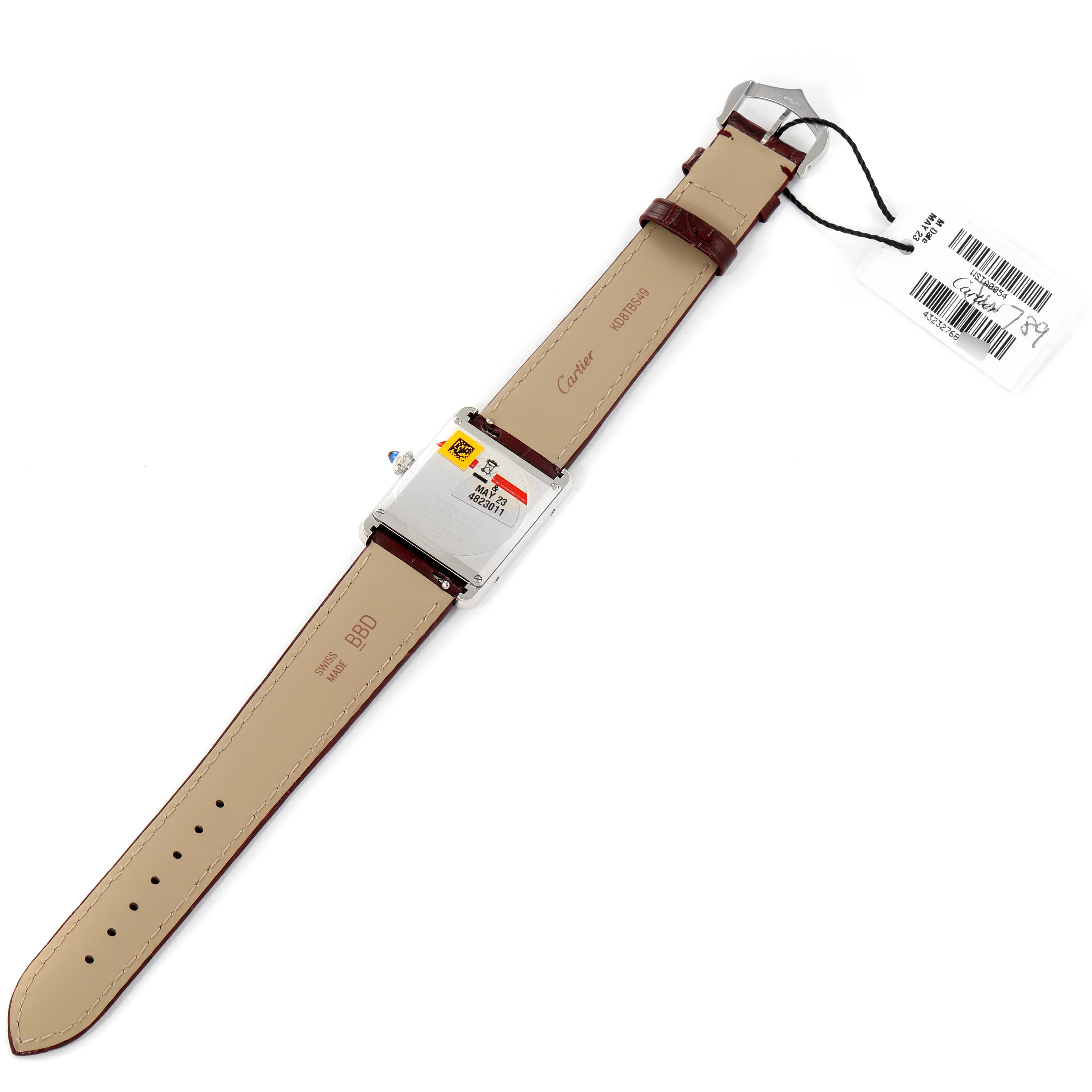 The image shows the back and inside of the strap of a Cartier Tank Must WSTA0054 Women's Stainless Steel Red Dial WSTA0054 Women's Stainless Steel Red Dial model watch lying flat.