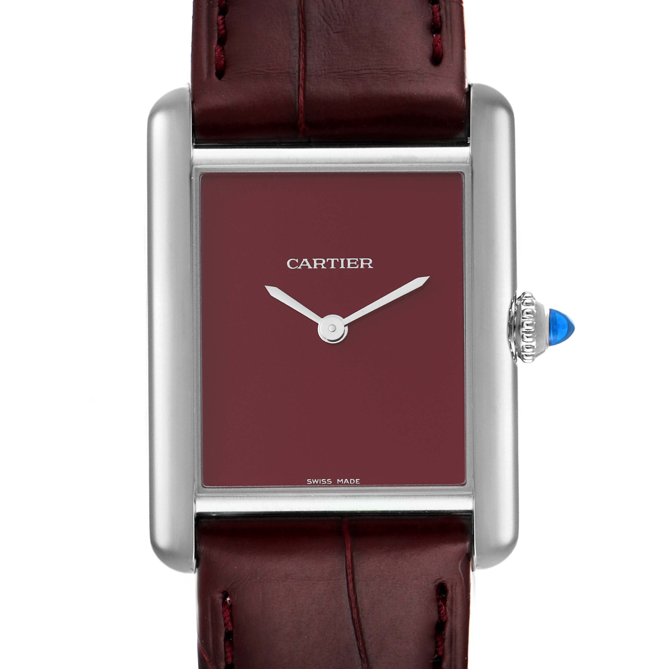 The image shows a frontal view of the Cartier Tank Must WSTA0054 Women's Stainless Steel Red Dial WSTA0054 Women's Stainless Steel Red Dial watch, highlighting the burgundy dial and leather strap.