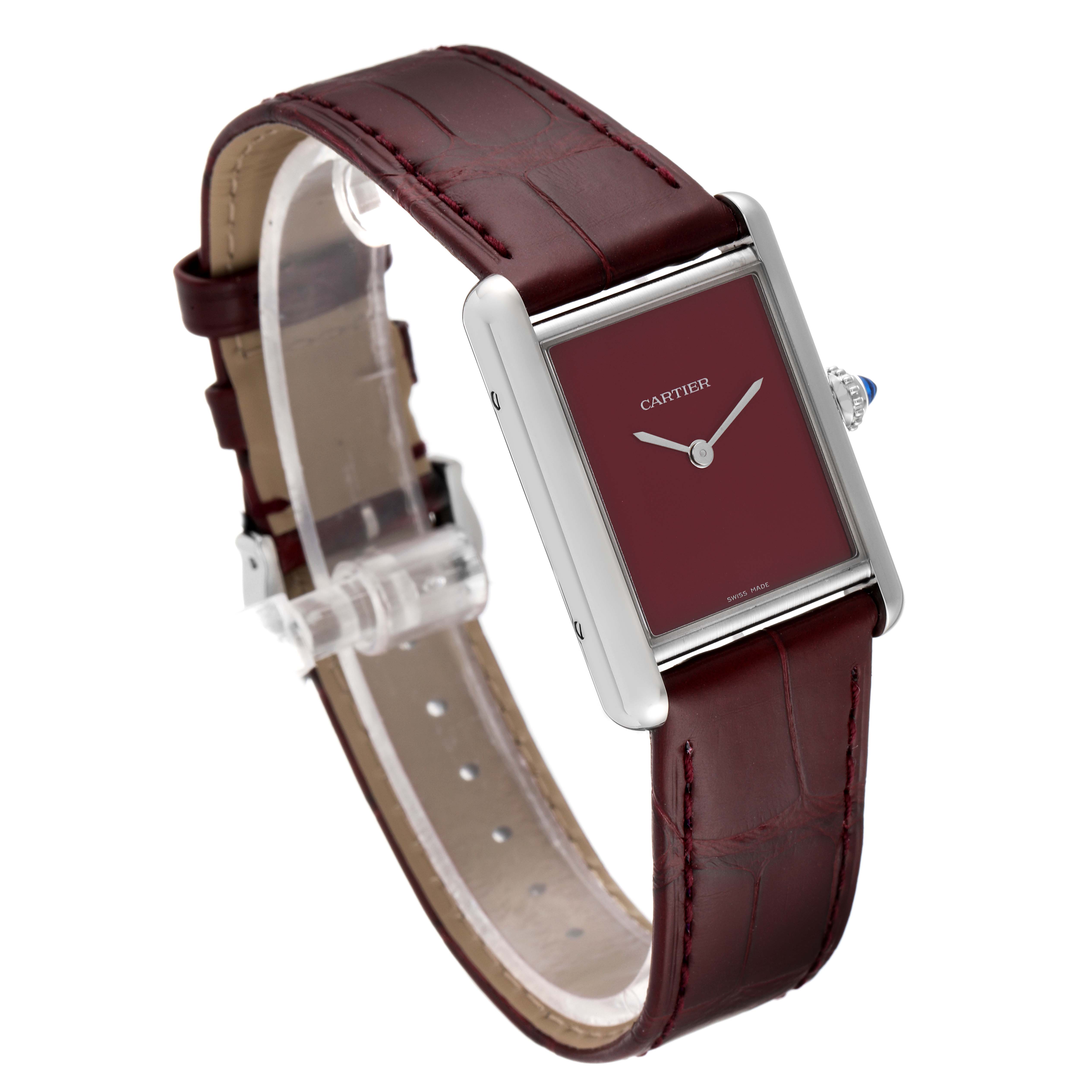 This image shows a Cartier Tank Must WSTA0054 Women's Stainless Steel Red Dial WSTA0054 Women's Stainless Steel Red Dial model watch at a three-quarter angle, highlighting its maroon strap, rectangular face, and crown.