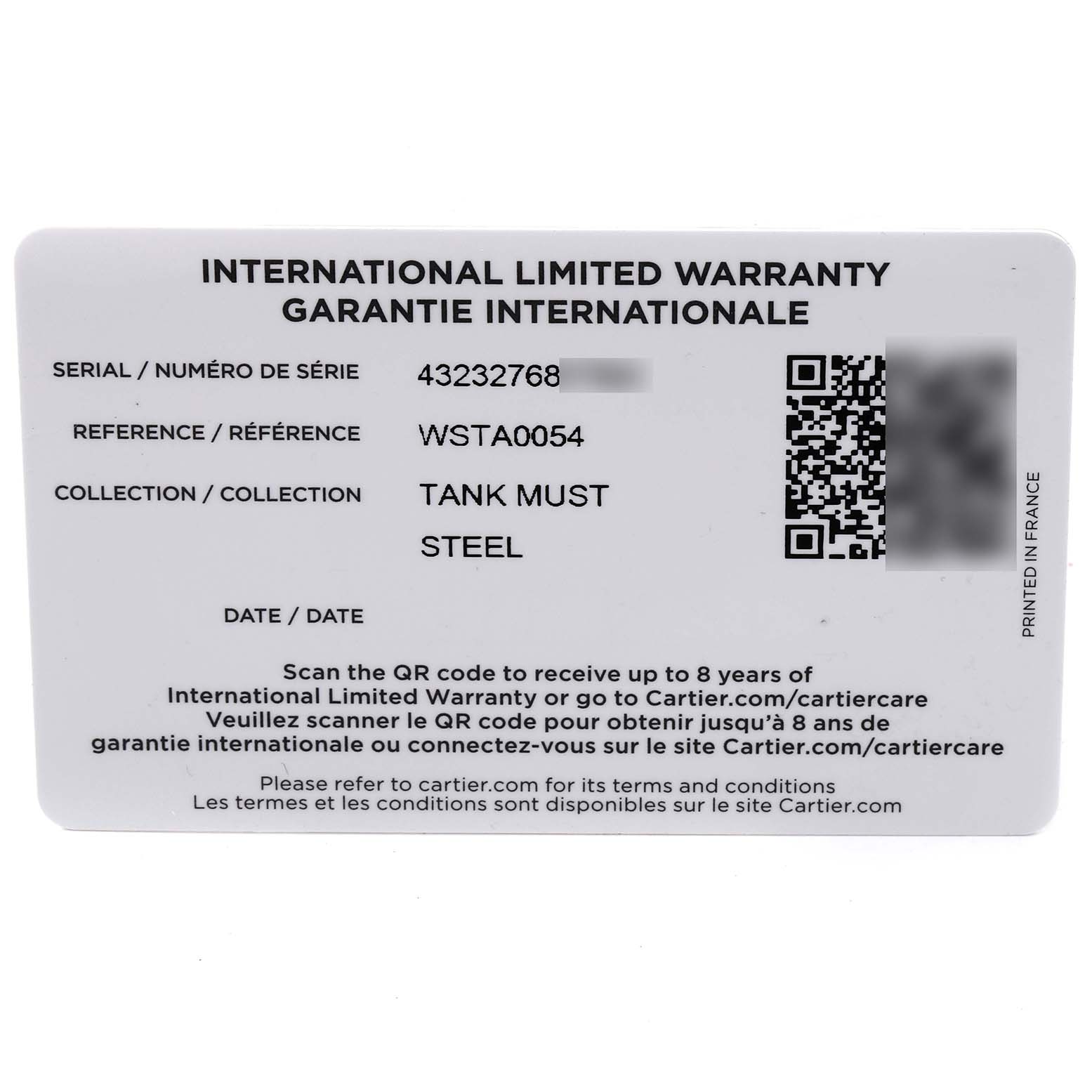 The image shows an international limited warranty card for a Cartier Tank Must WSTA0054 Women's Stainless Steel Red Dial WSTA0054 Women's Stainless Steel Red Dial watch, displaying serial number, reference, and collection details.