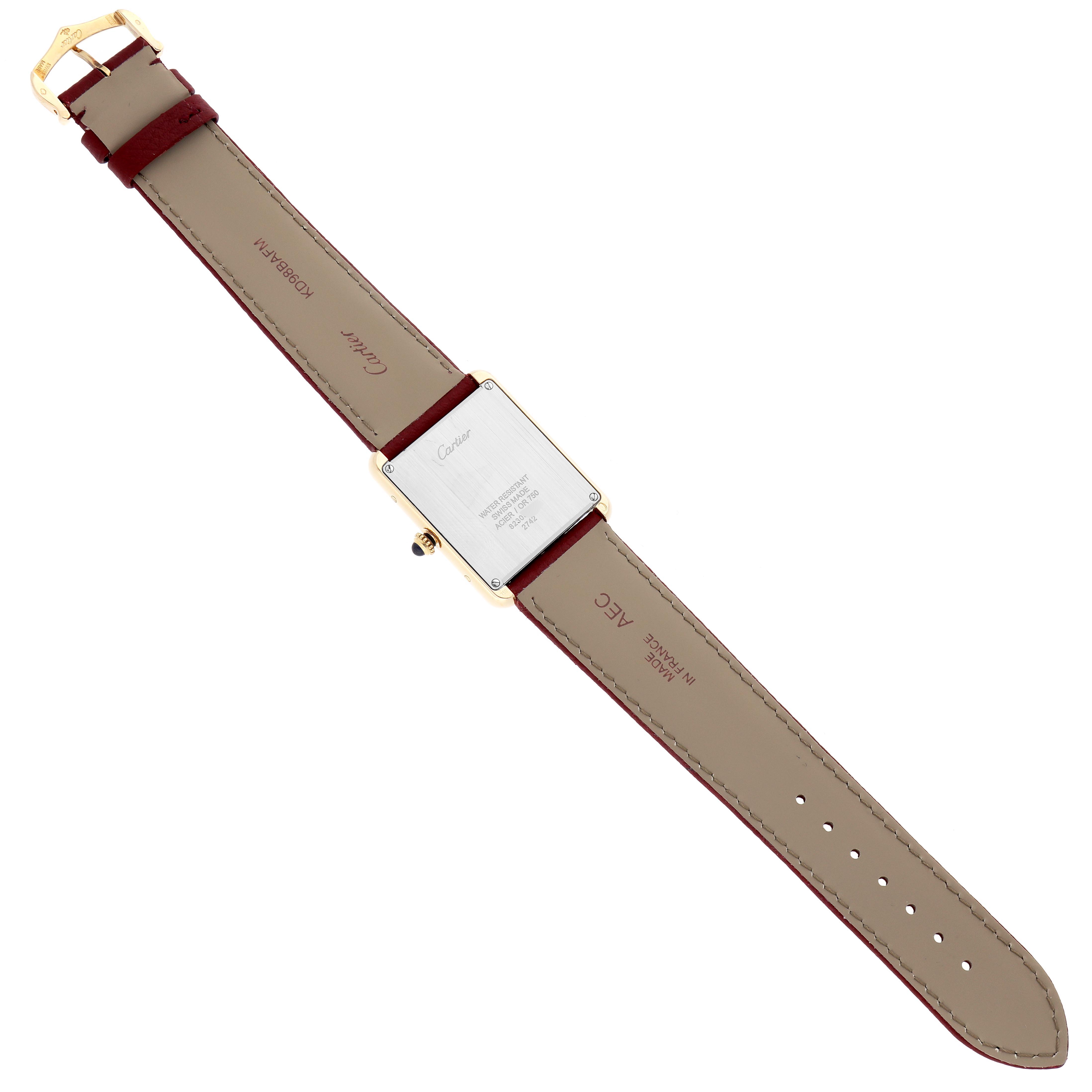 The Cartier Tank Solo W1018855 Men
s Steel and Gold (two tone) Silver Dial W1018855 Men
s Steel and Gold (two tone) Silver Dial watch is shown from the back, highlighting the case back, straps, and buckle.