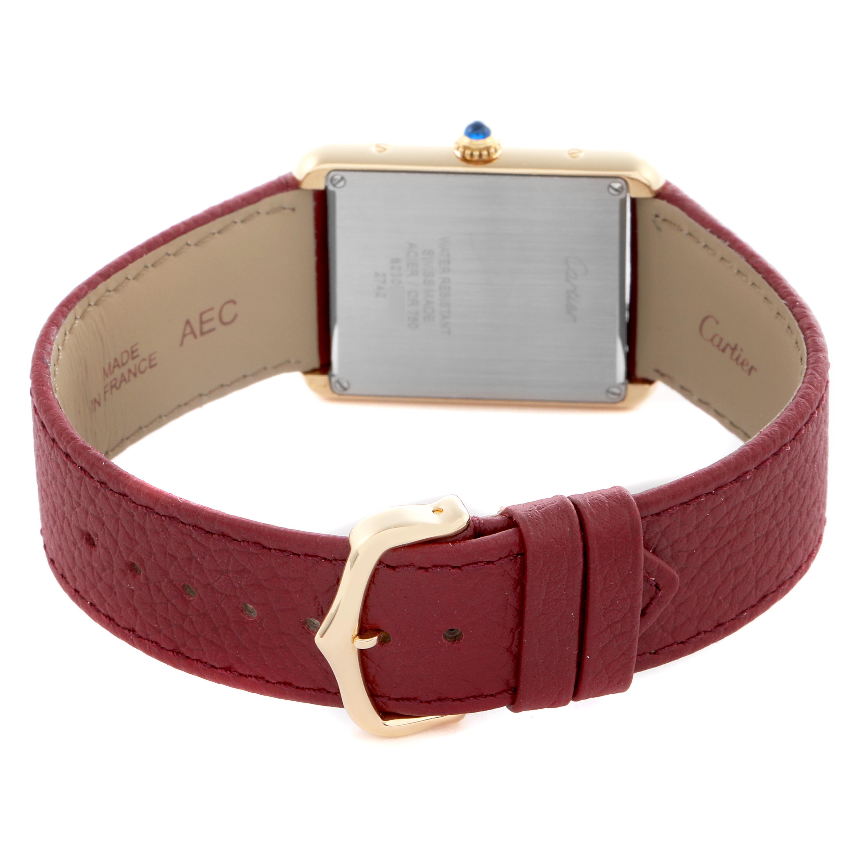 The image shows the back view of a Cartier Tank Solo W1018855 Men
s Steel and Gold (two tone) Silver Dial W1018855 Men
s Steel and Gold (two tone) Silver Dial watch, highlighting the clasp, case back, and leather strap.