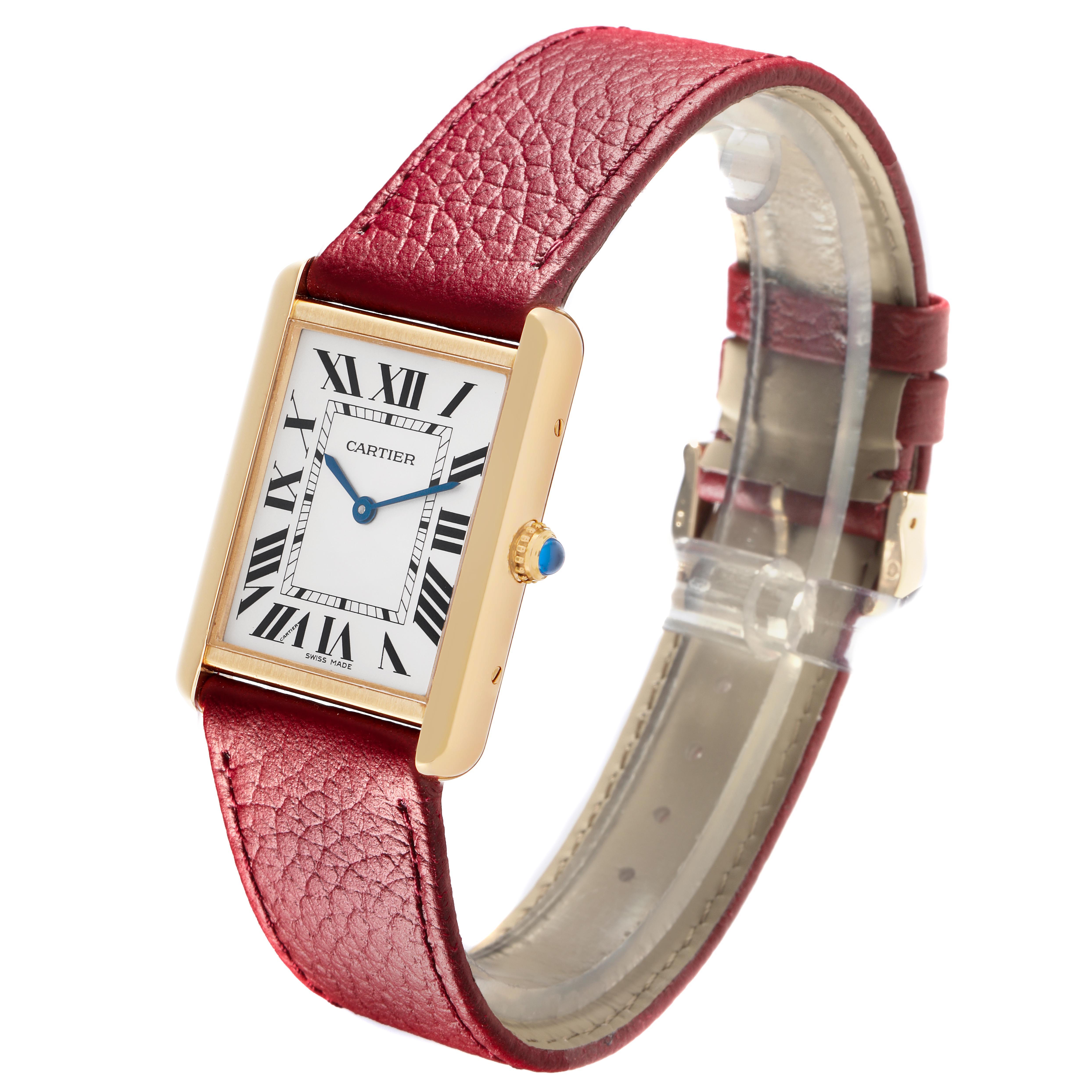 The Cartier Tank Solo W1018855 Men
s Steel and Gold (two tone) Silver Dial watch is shown at a slight angle, highlighting the face, red leather strap, and side crown.