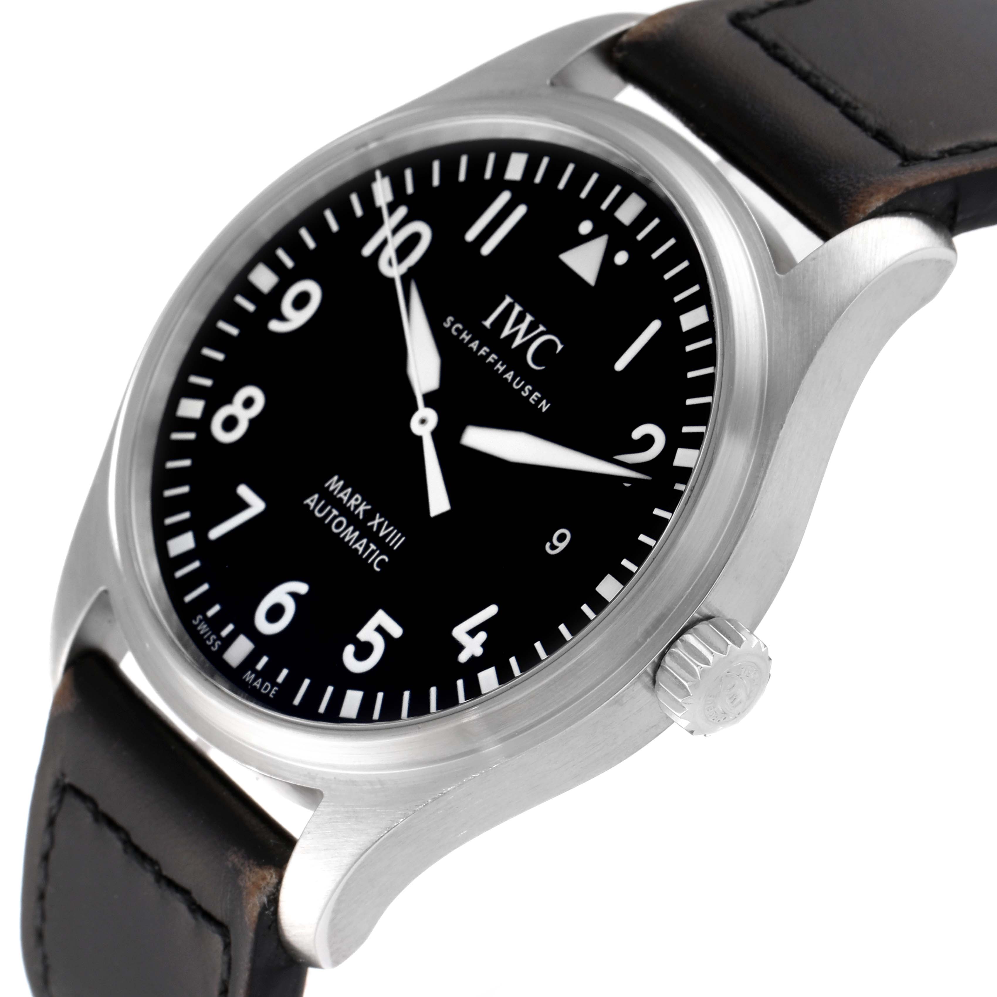 The image shows a close-up angle of the IWC Pilot IW327001 Men
s Stainless Steel Black Dial IW327001 Men
s Stainless Steel Black Dial Mark XVIII Automatic watch, highlighting the dial, crown, and leather strap.