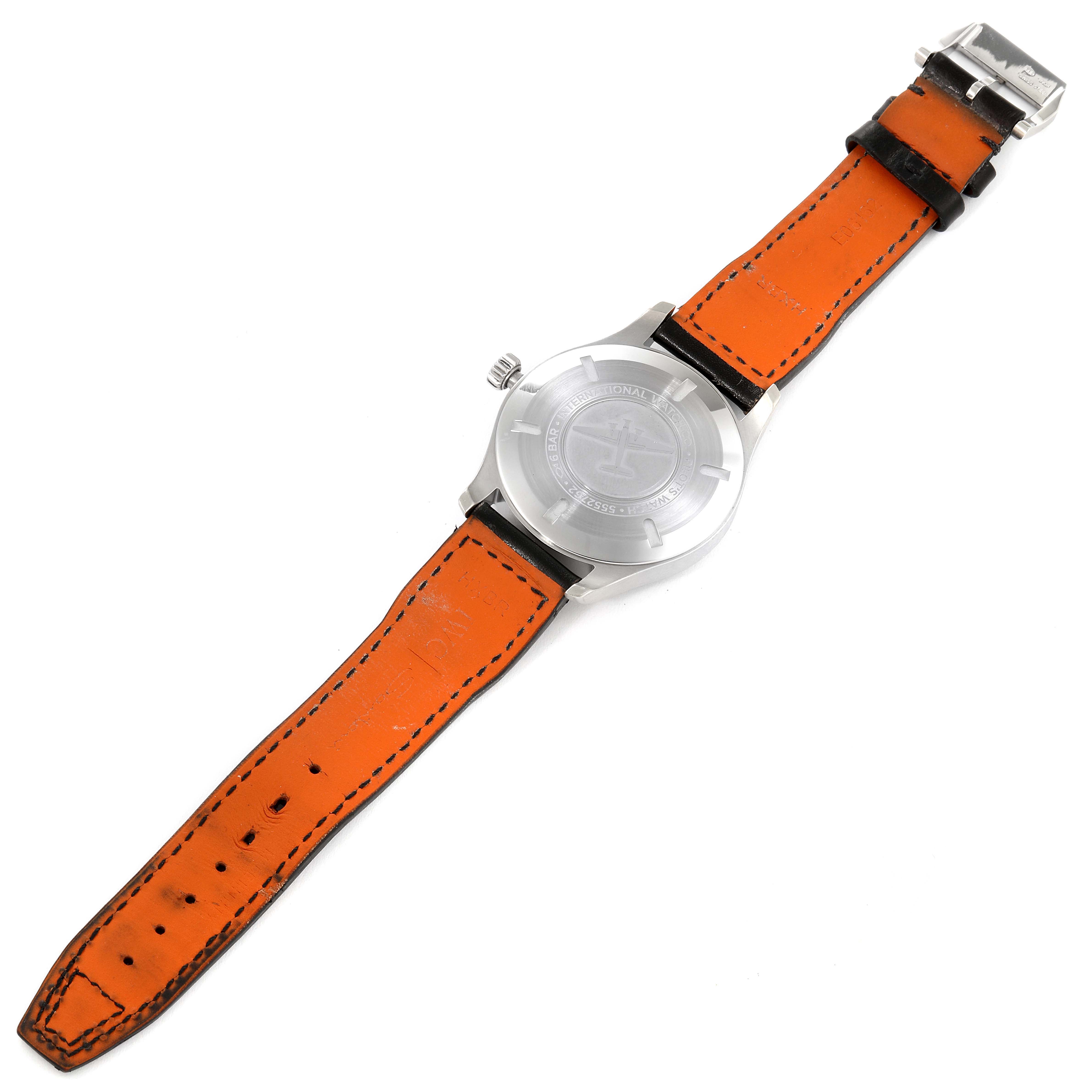 This image shows the back case and leather strap of an IWC Pilot IW327001 Men
s Stainless Steel Black Dial IW327001 Men
s Stainless Steel Black Dial model watch, with an orange underside and silver clasp.