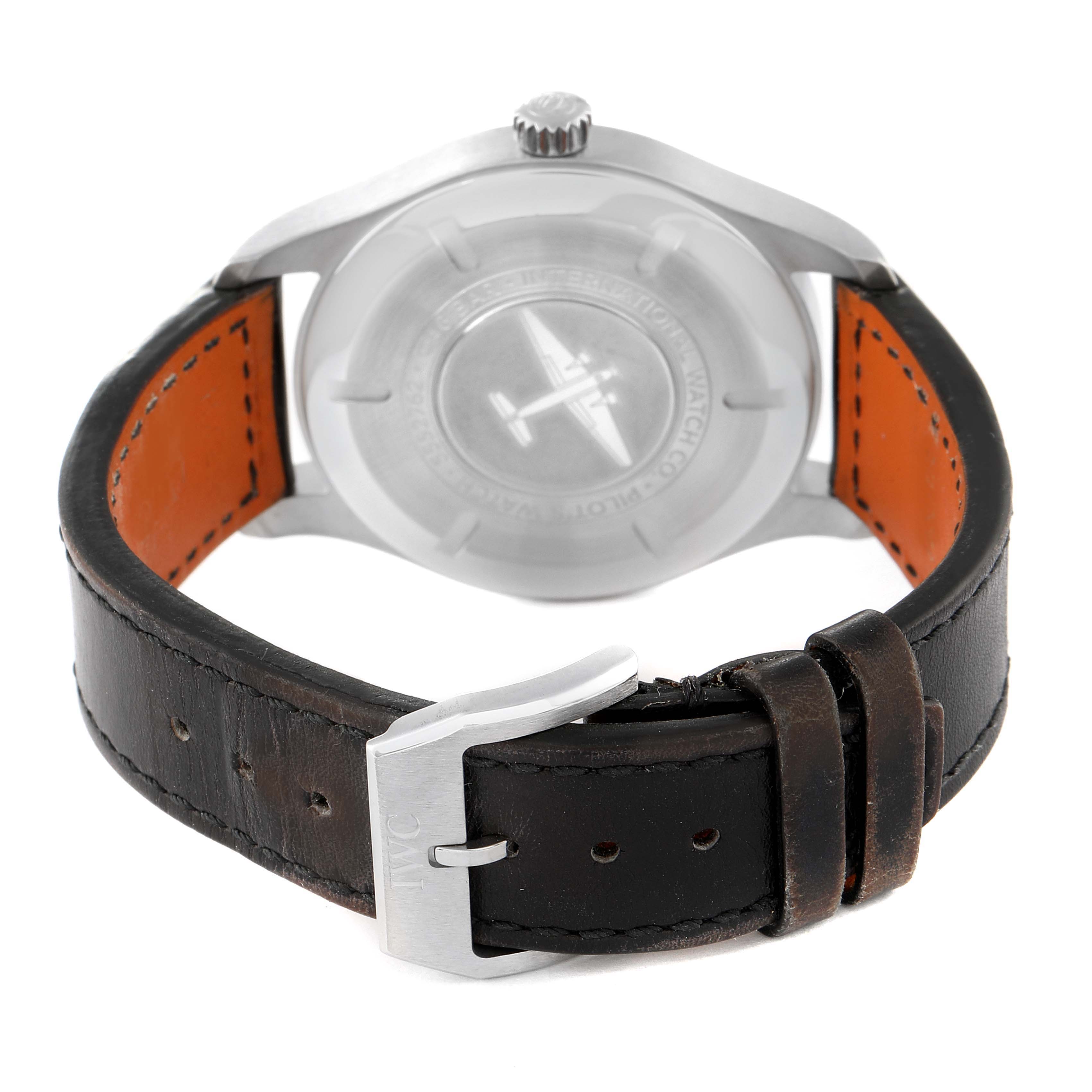 The image shows the back of the IWC Pilot IW327001 Men
s Stainless Steel Black Dial IW327001 Men
s Stainless Steel Black Dial watch, focusing on its case back, crown, and leather strap with a buckle.