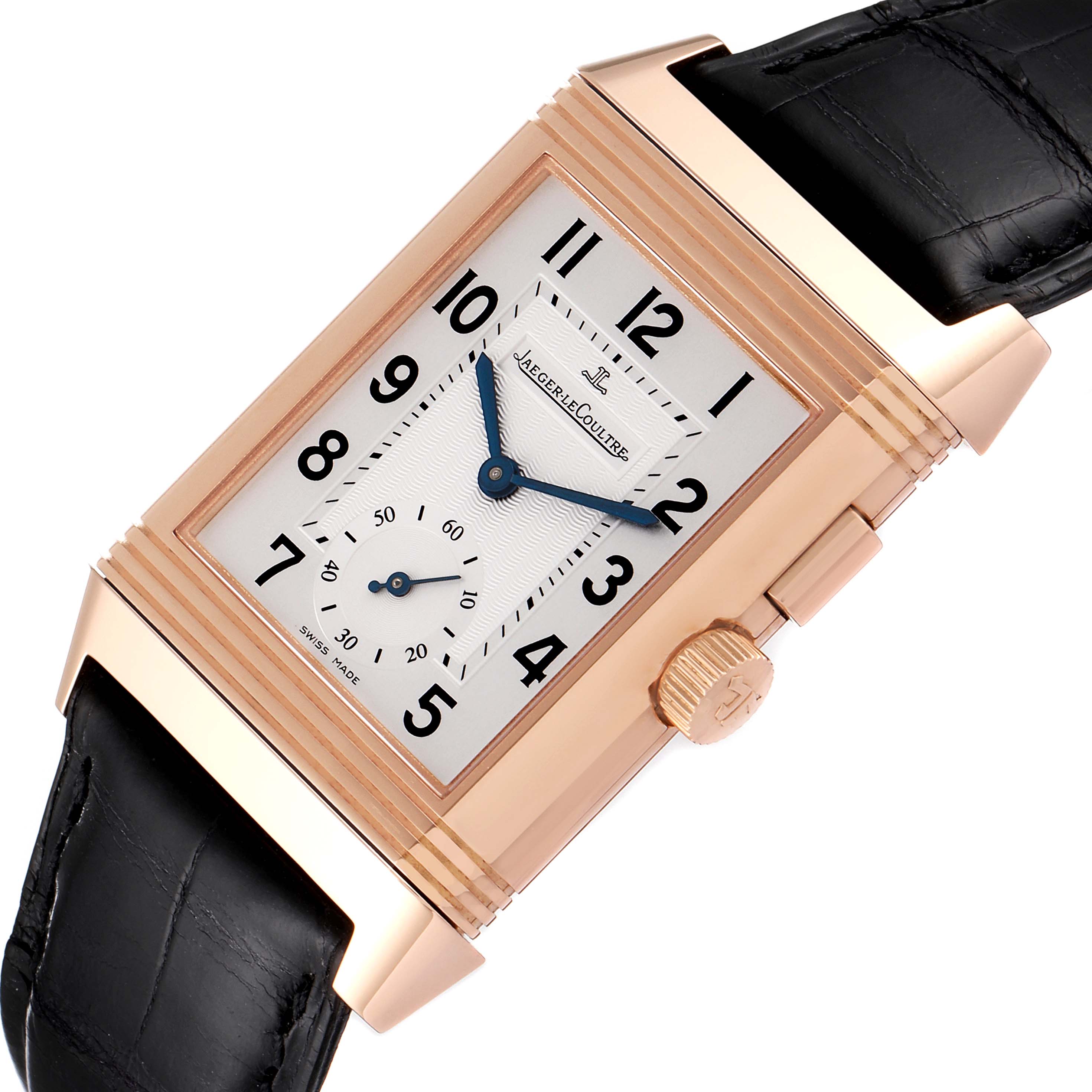 The image shows a Jaeger LeCoultre Reverso 272.2.54 Men's Rose Gold Silver Dial 272.2.54 Men's Rose Gold Silver Dial watch at a slight angle with a focus on the dial, crown, and black leather strap.