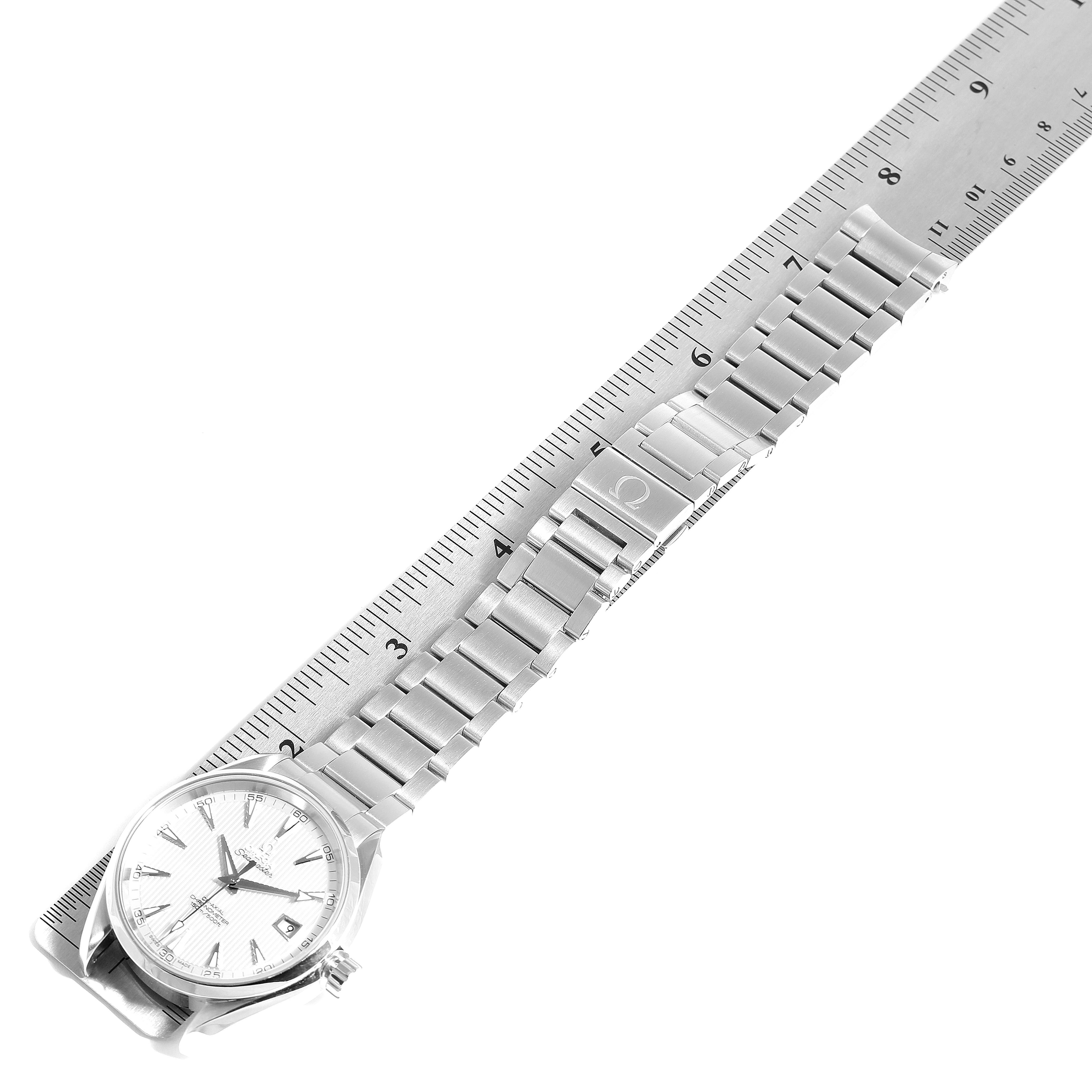 The image shows the Omega Aqua Terra 231.10.42.21.02.001 Men
s Stainless Steel Silver Dial 231.10.42.21.02.001 Men
s Stainless Steel Silver Dial watch laid flat next to a ruler, displaying the bracelet and watch case.