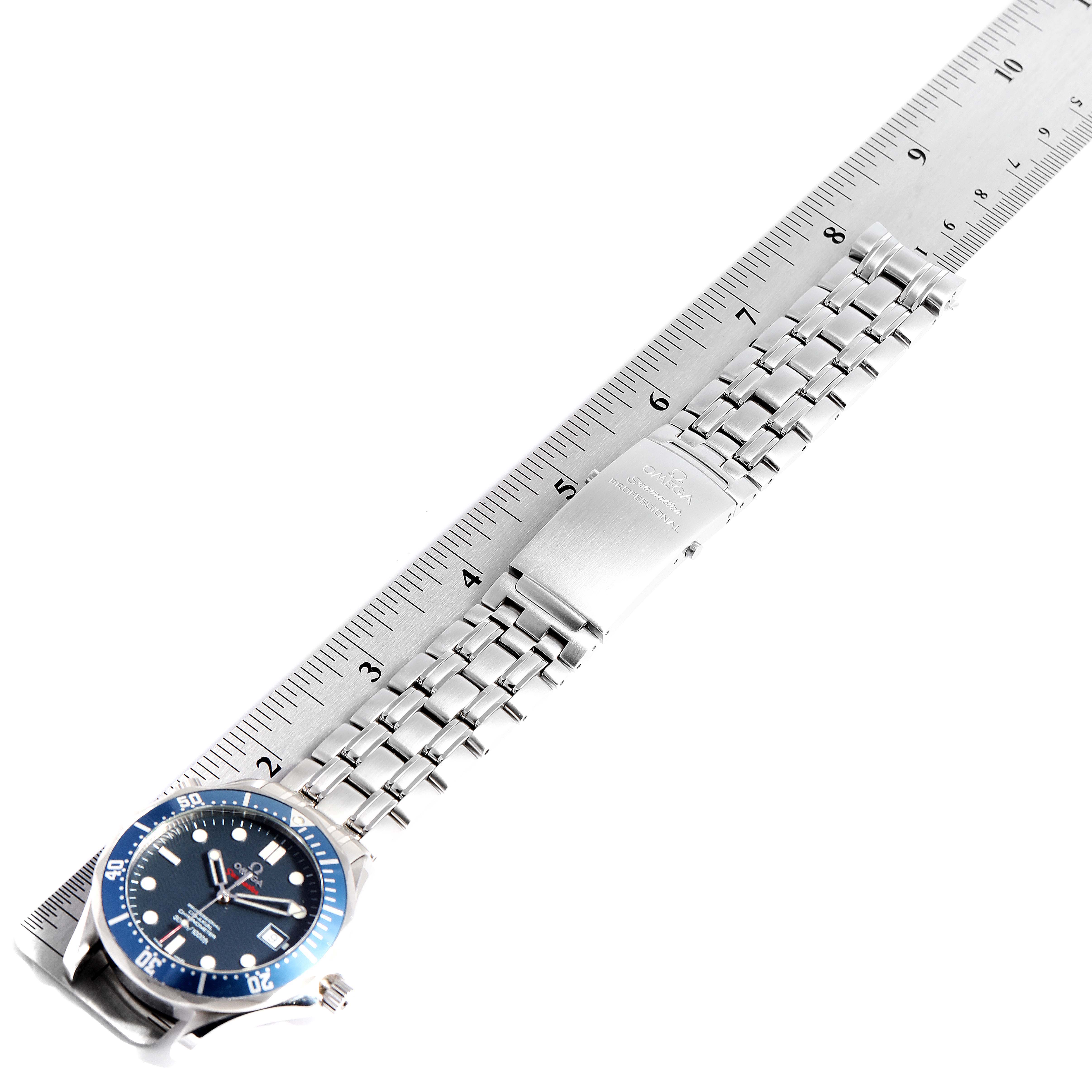 The image shows an Omega Seamaster 2220.80.00 Men
s Stainless Steel Blue Dial 2220.80.00 Men
s Stainless Steel Blue Dial watch laid flat alongside a ruler, highlighting the face and bracelet.