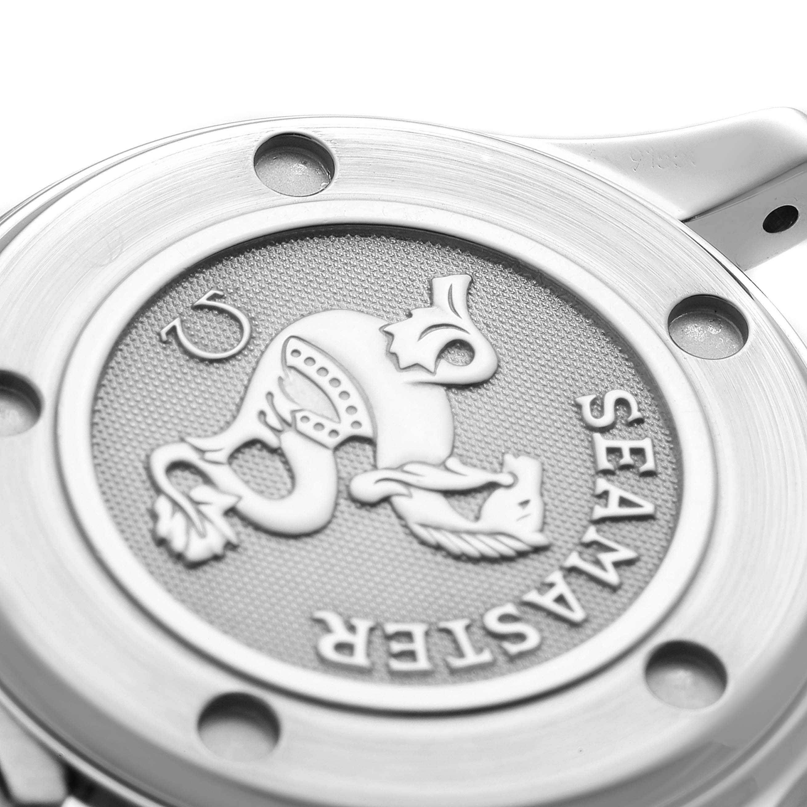 The image shows a close-up of the case back of the Omega 2224.80.00 Women's Stainless Steel Blue Dial 2224.80.00 Women's Stainless Steel Blue Dial Seamaster Diver 300M 28mm Steel Ladies Watch 2224.80.00, featuring the Seamaster logo.