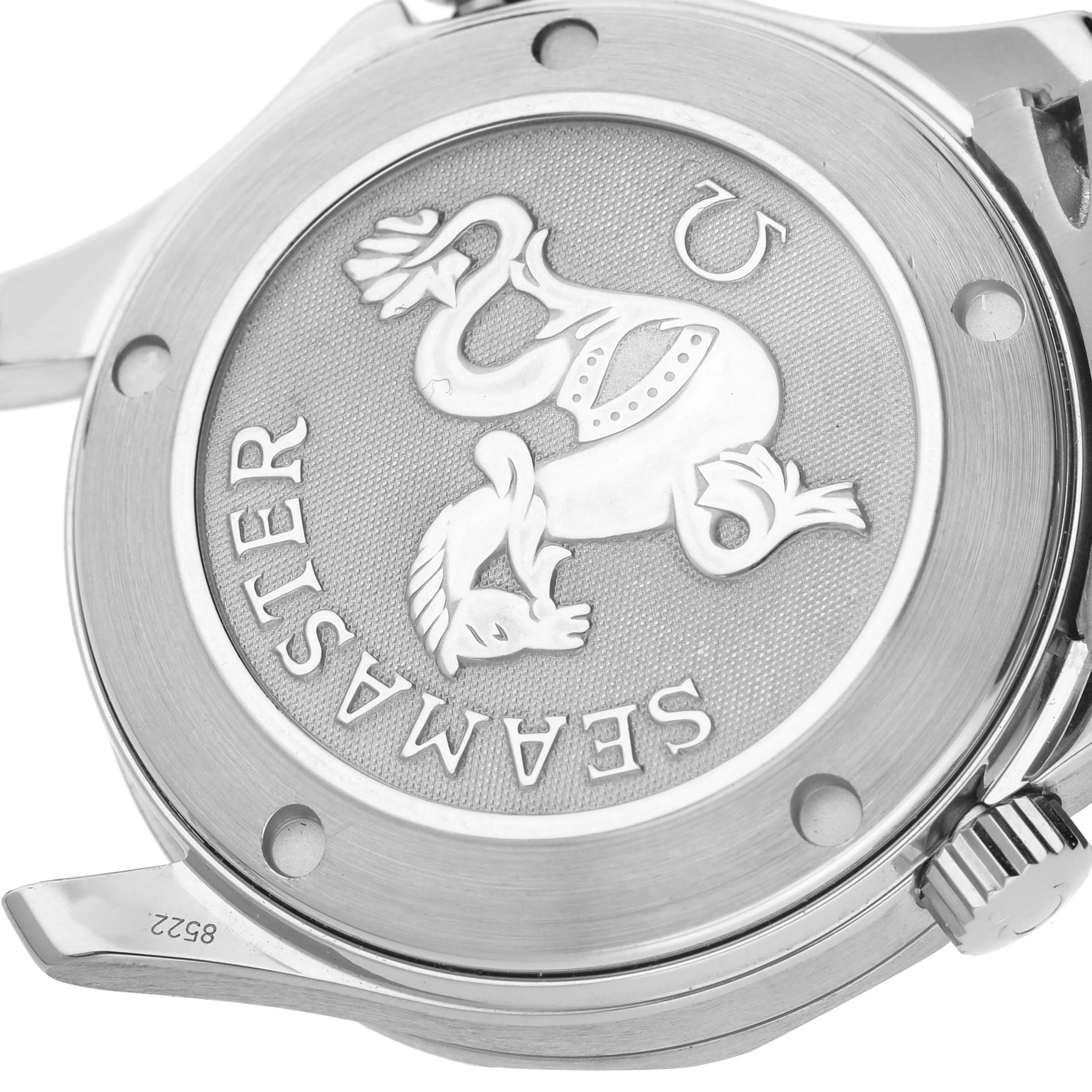 The image shows the embossed case back of an Omega Seamaster 212.30.36.20.01.001 Men's Stainless Steel Black Dial watch, angled slightly to display the engraved logo and text.