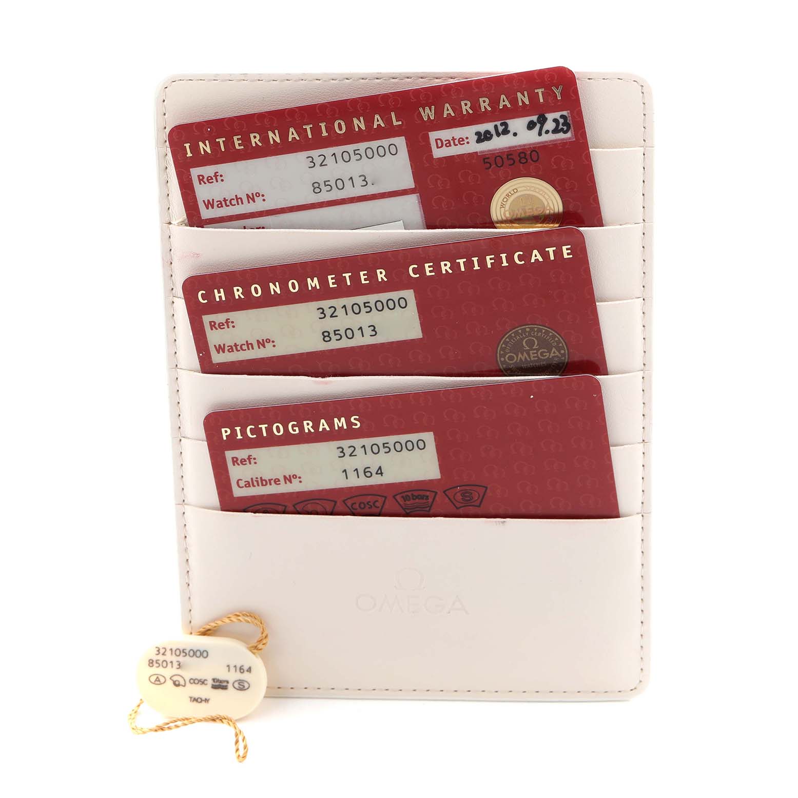 The image shows Omega Speedmaster 3210.50.00 Men's Stainless Steel Black Dial 3210.50.00 Men's Stainless Steel Black Dial documentation, including an international warranty card, chronometer certificate, and pictograms, all in a white holder.