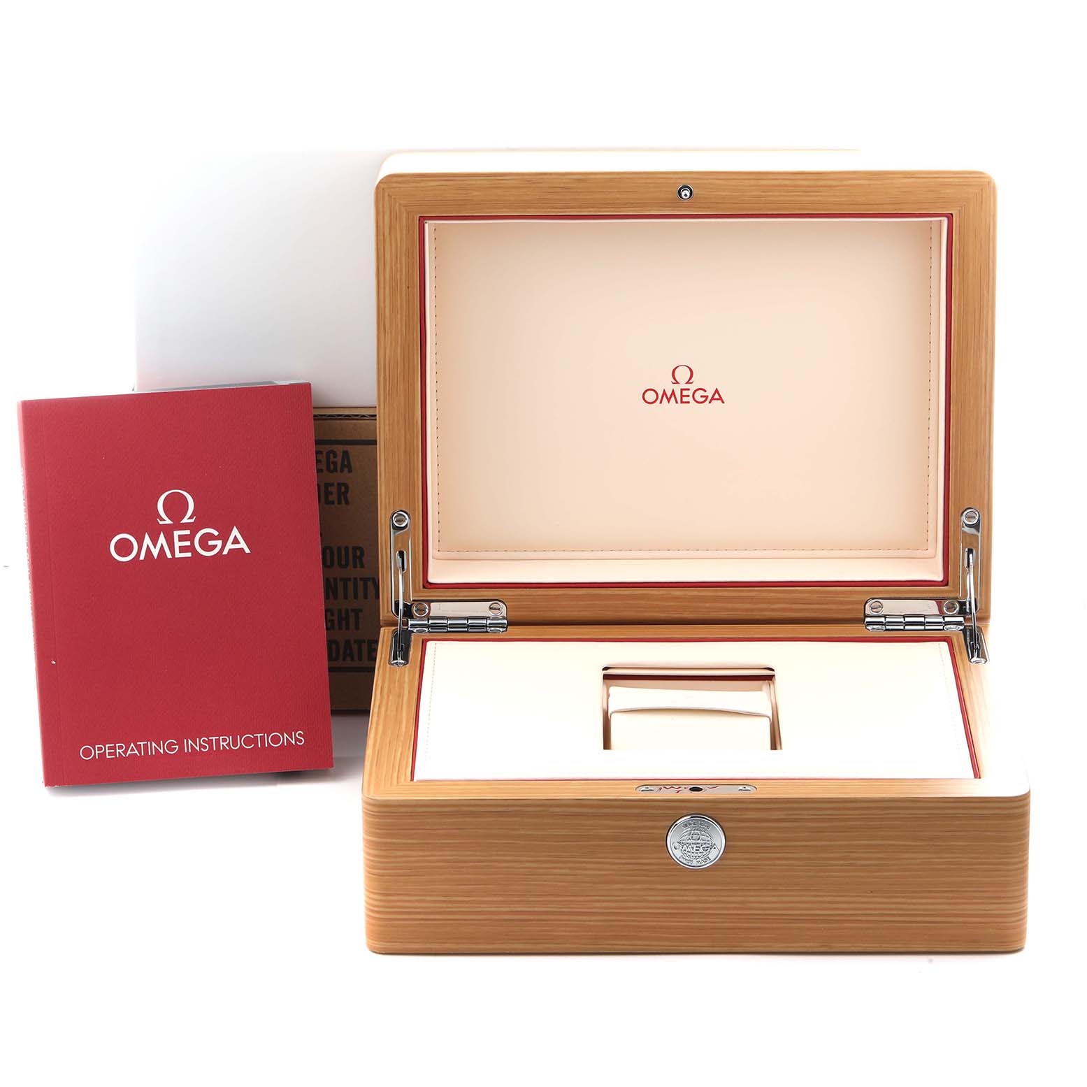 The image shows an open Omega Speedmaster 311.32.40.30.01.001 Men's Stainless Steel Black Dial 311.32.40.30.01.001 Men's Stainless Steel Black Dial watch box with a red operating instructions booklet beside it.