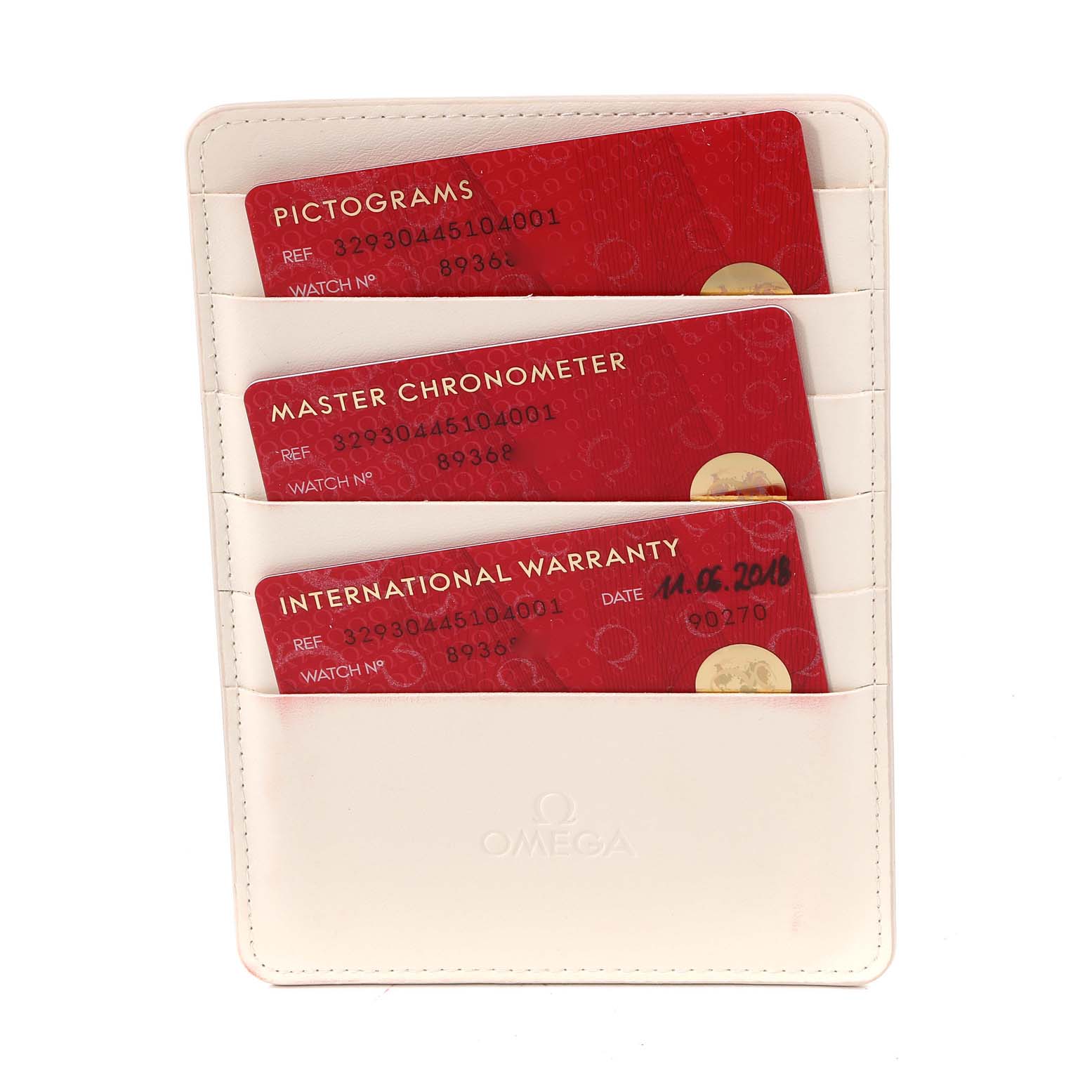 The image shows Omega Speedmaster 329.30.44.51.04.001 Men
s Stainless Steel White Dial 329.30.44.51.04.001 Men
s Stainless Steel White Dial accessories including three red certification cards in a white card holder.