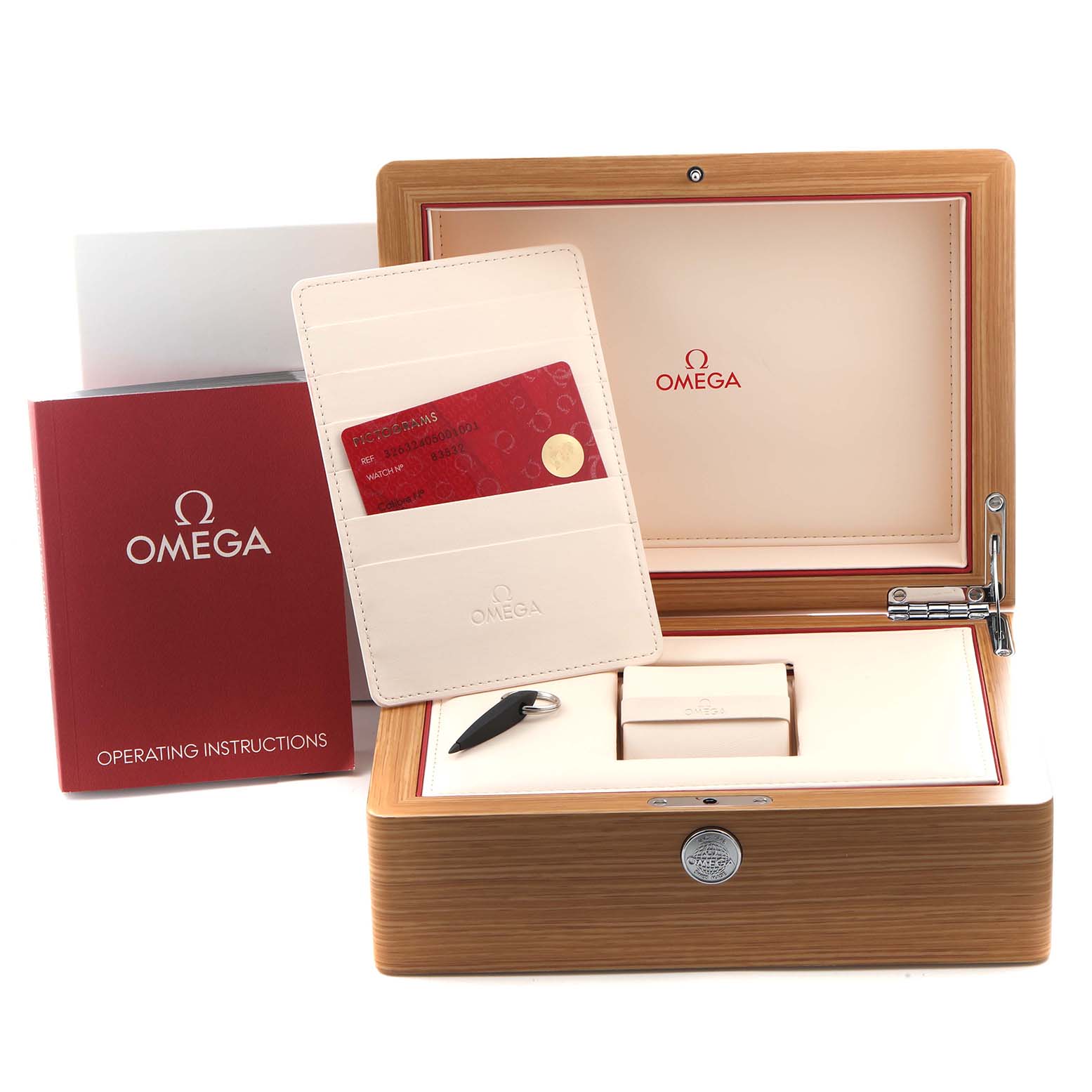 The image shows the Omega Speedmaster 326.32.40.50.01.001 Men's Stainless Steel Black Dial 326.32.40.50.01.001 Men's Stainless Steel Black Dial watch box, warranty cards, operating instructions, and accessory tools.