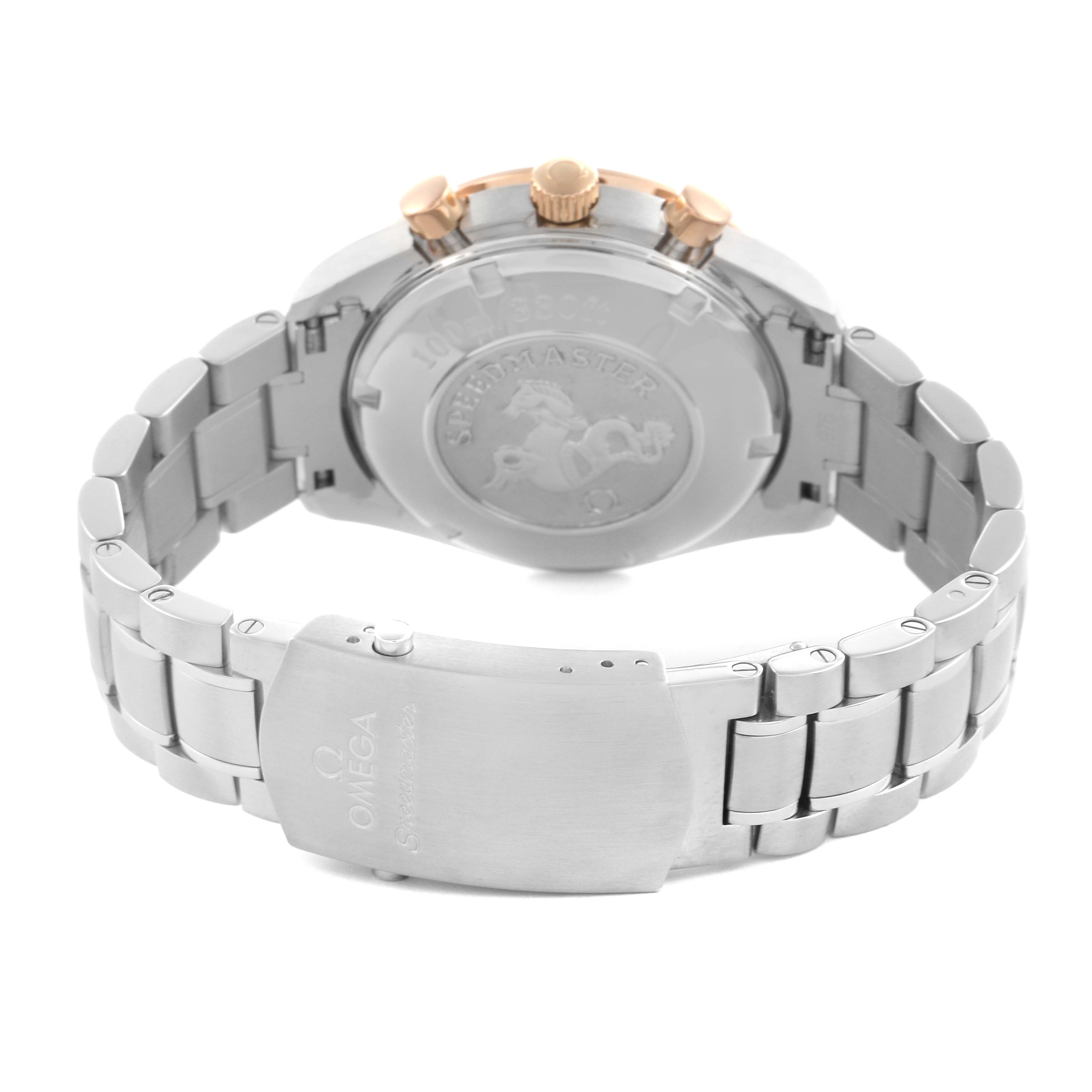 The Omega Speedmaster 323.21.40.40.01.001 Men's Steel and Gold (two tone) Black Dial 323.21.40.40.01.001 Men's Steel and Gold (two tone) Black Dial watch is shown from a rear angle, highlighting the case back and bracelet clasp.