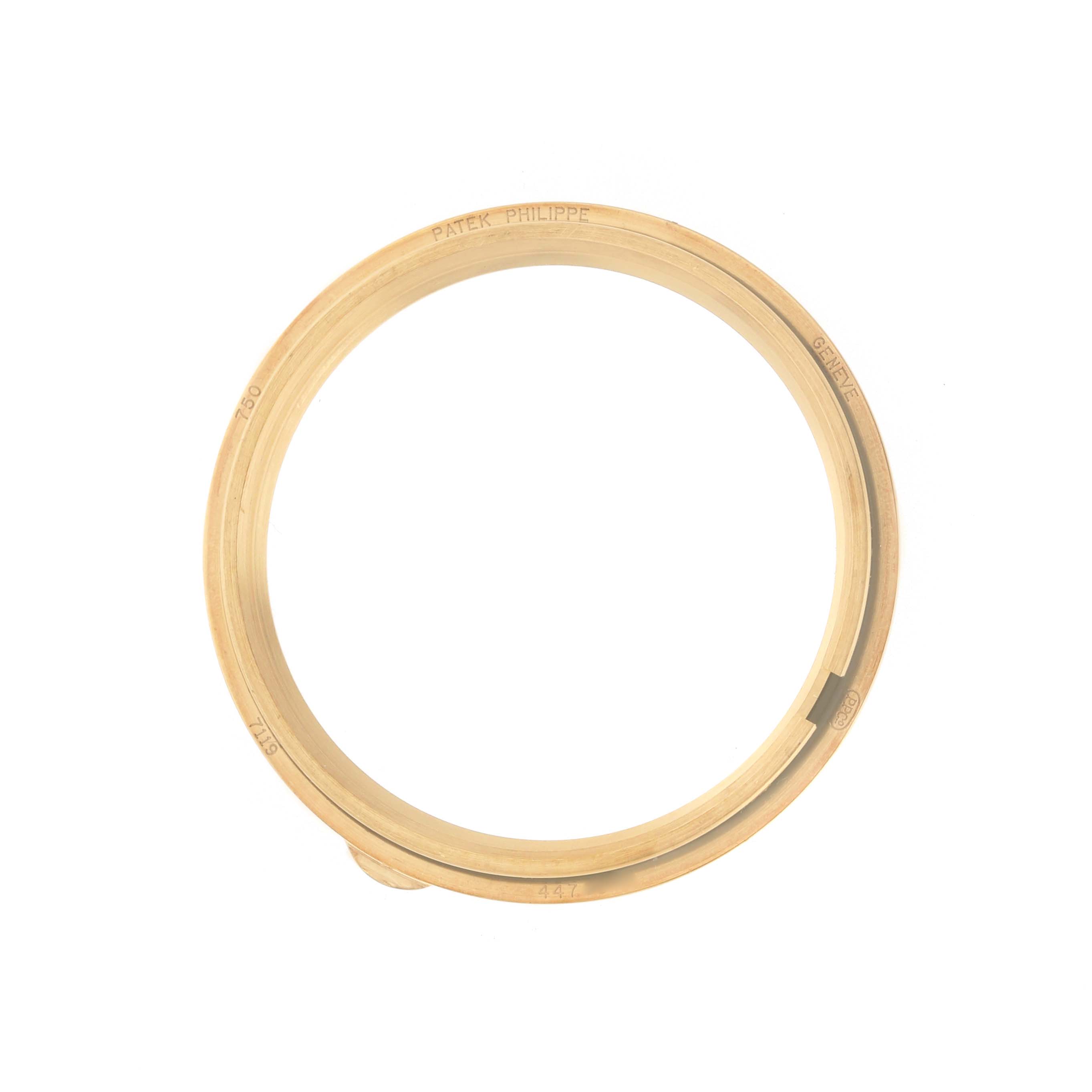 The image shows a gold bezel from a Patek Philippe Calatrava 7119 / 7119J Women's Yellow Gold White Dial watch viewed from the front.