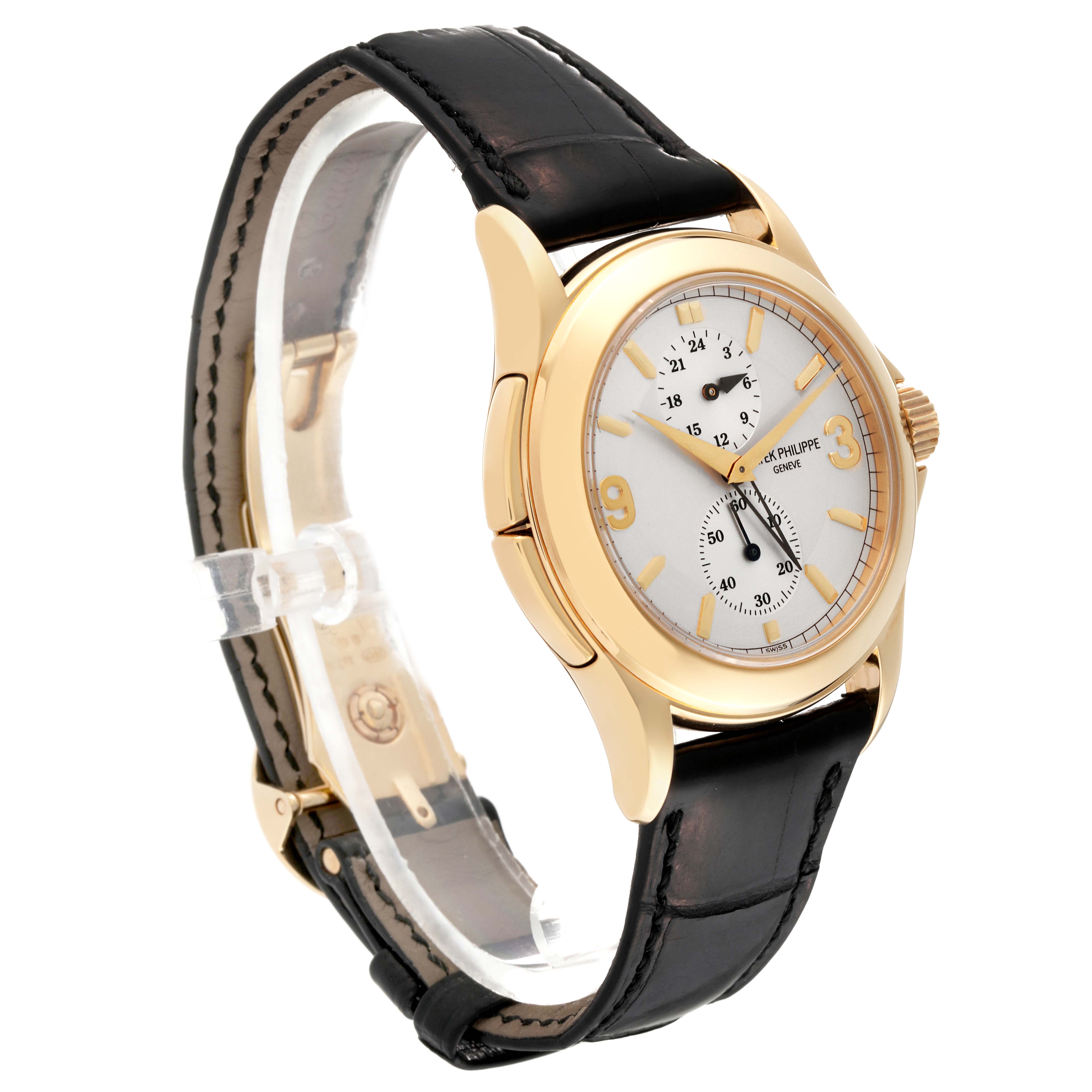 The image shows a Patek Philippe Calatrava 5134J Men's Yellow Gold Silver Dial 5134J Men's Yellow Gold Silver Dial watch at a slight angle, displaying its face, crown, case, and leather strap.