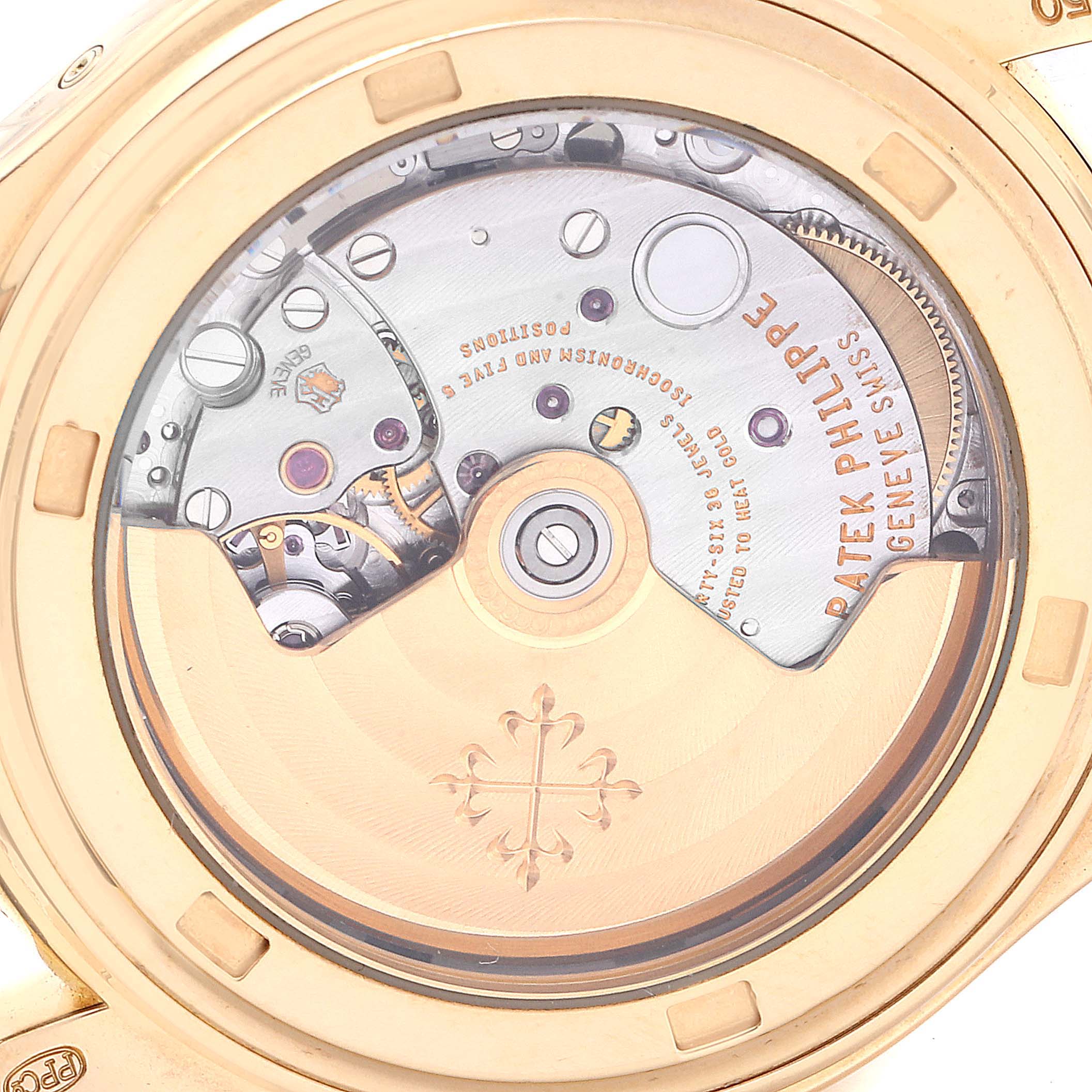 The image shows the back case and intricate movement of a Patek Philippe 5146J Men's Yellow Gold Beige Dial 5146J Men's Yellow Gold Beige Dial Complicated Annual Calendar Yellow Gold Men's Watch 5146 model.