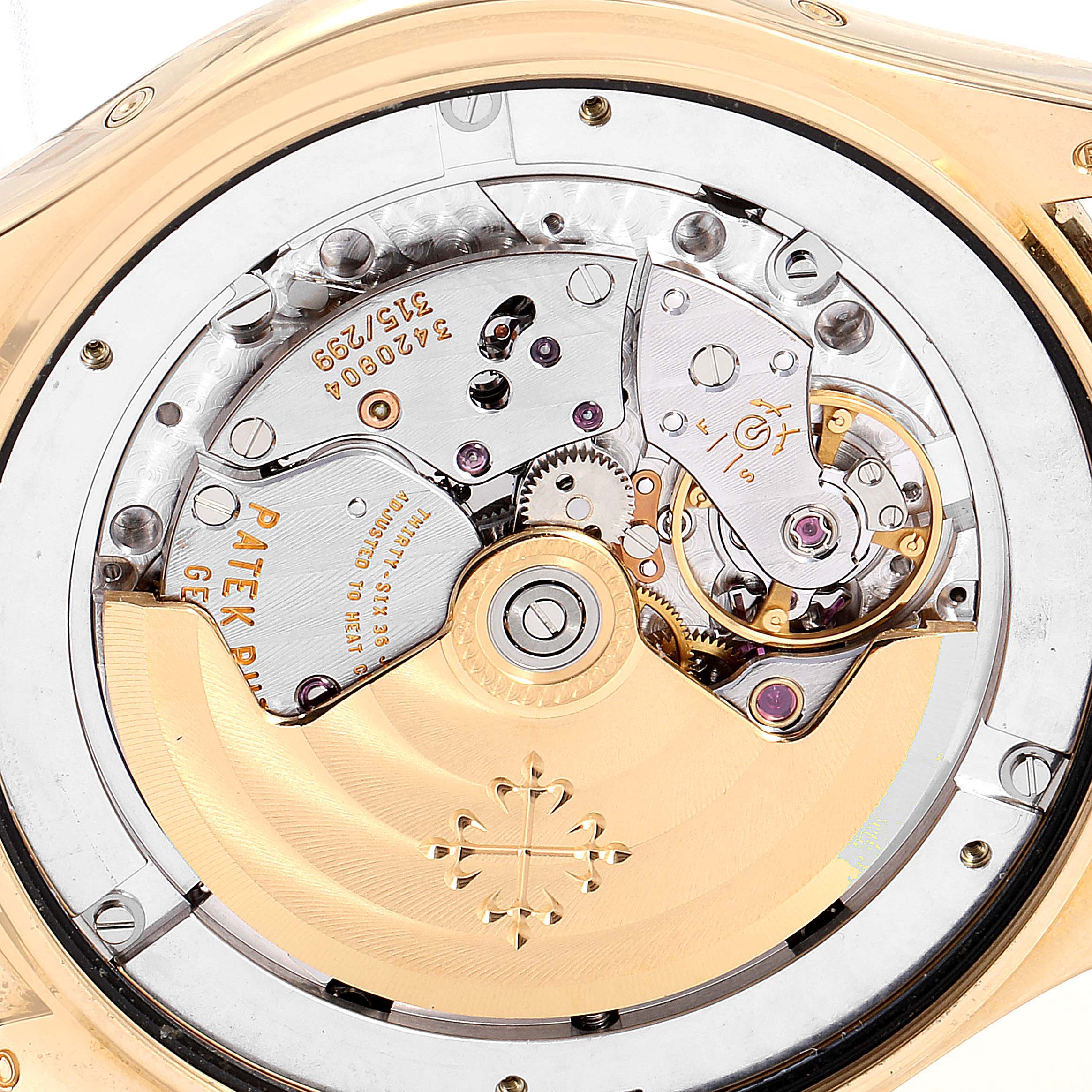This image shows the intricate movement and internal mechanism of the Patek Philippe 5146J Men's Yellow Gold Beige Dial 5146J Men's Yellow Gold Beige Dial 5146 Complicated Annual Calendar Yellow Gold Men's Watch.