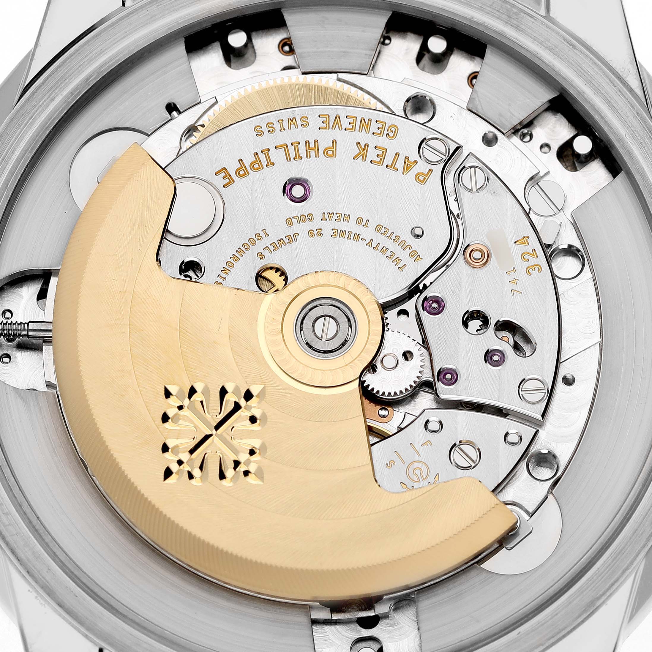The image shows a close-up view of the movement from the back of a Patek Philippe Complications 5320G-001 Men's Yellow Gold White Dial watch, highlighting its intricate gears and rotor.