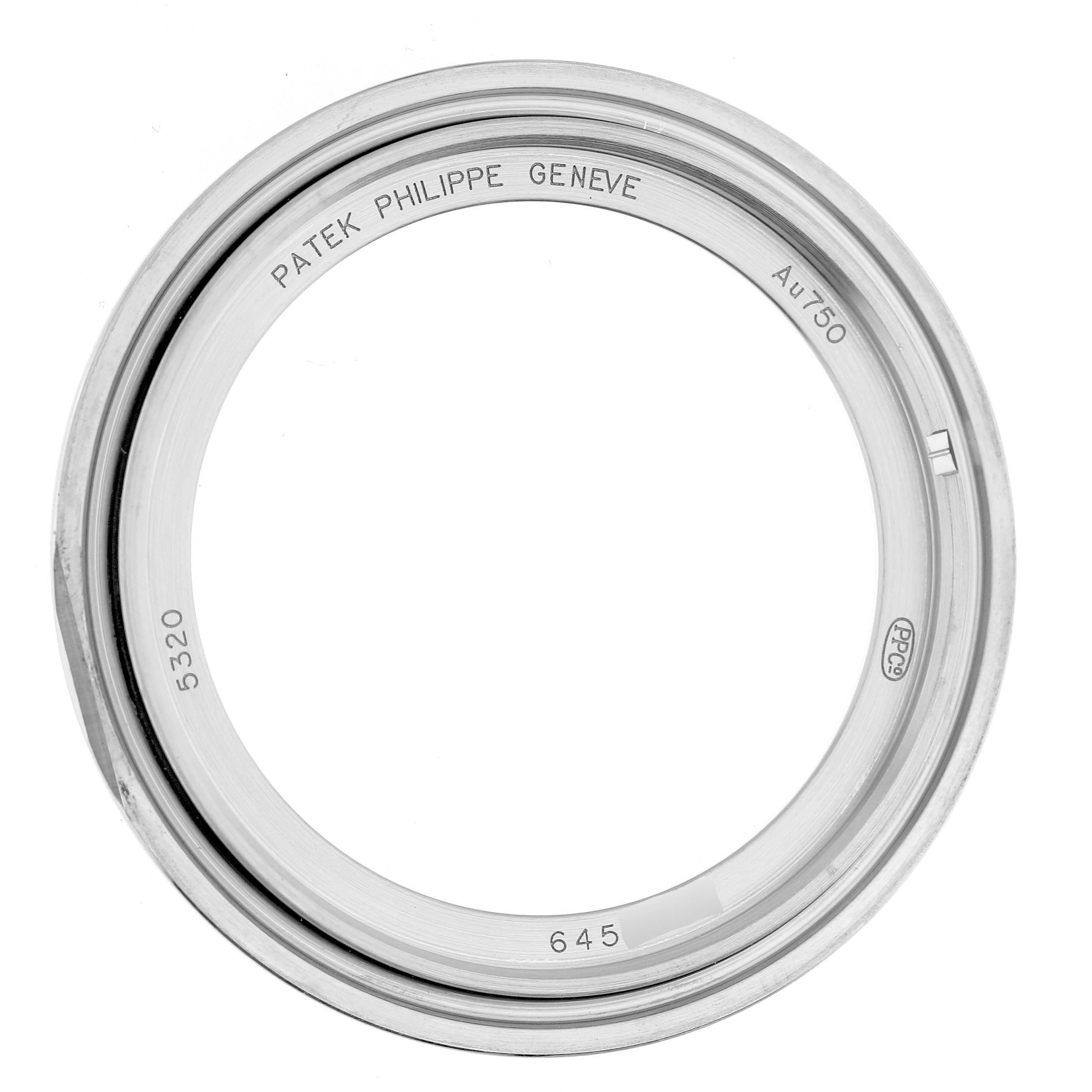 The image shows the case back ring of a Patek Philippe Complications 5320G-001 Men's Yellow Gold White Dial model, viewed from above with engravings visible.