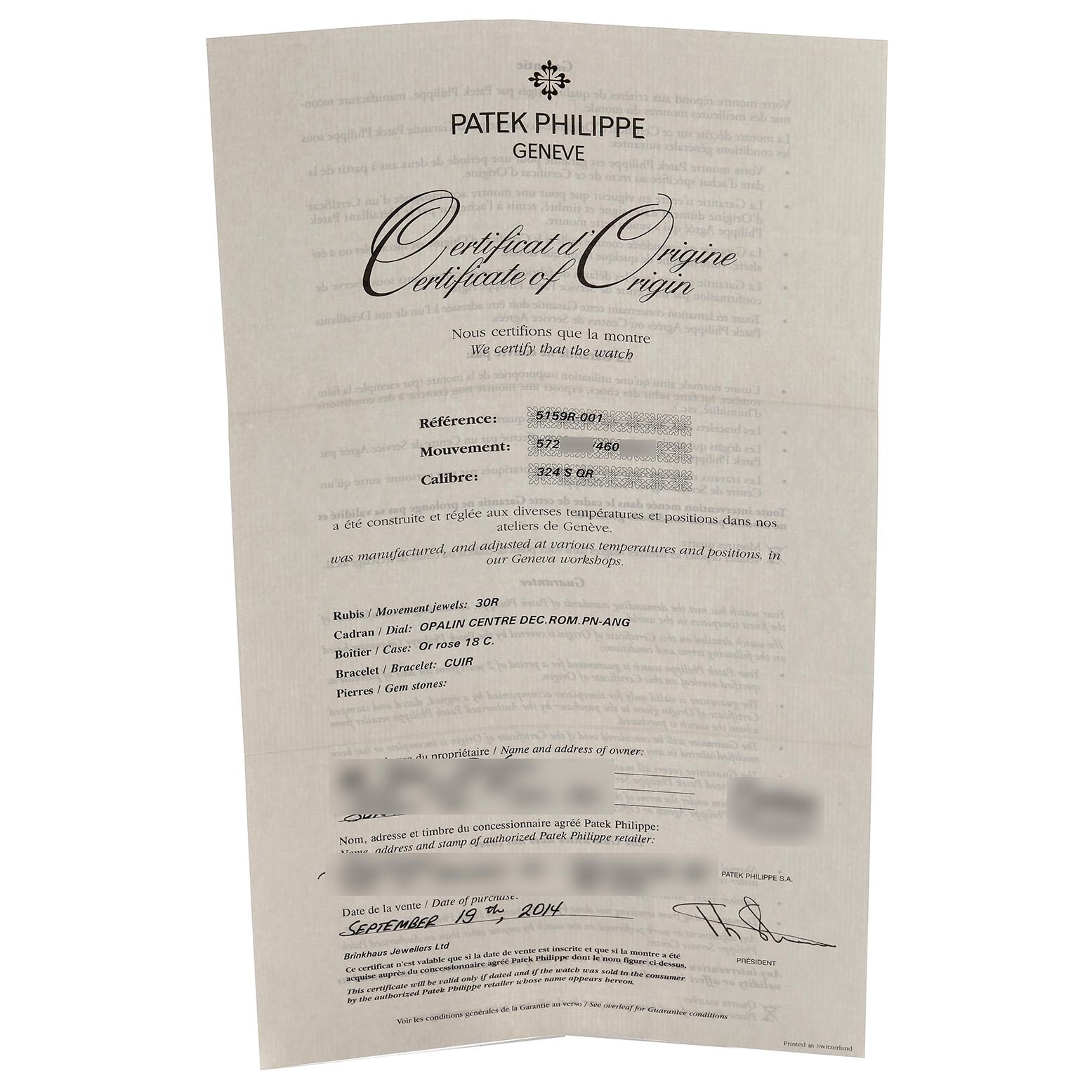 This image shows a Certificate of Origin for the Patek Philippe Complications 5159J-001 Men's Rose Gold White Dial 5159J-001 Men's Rose Gold White Dial model, angled slightly to display its details clearly.