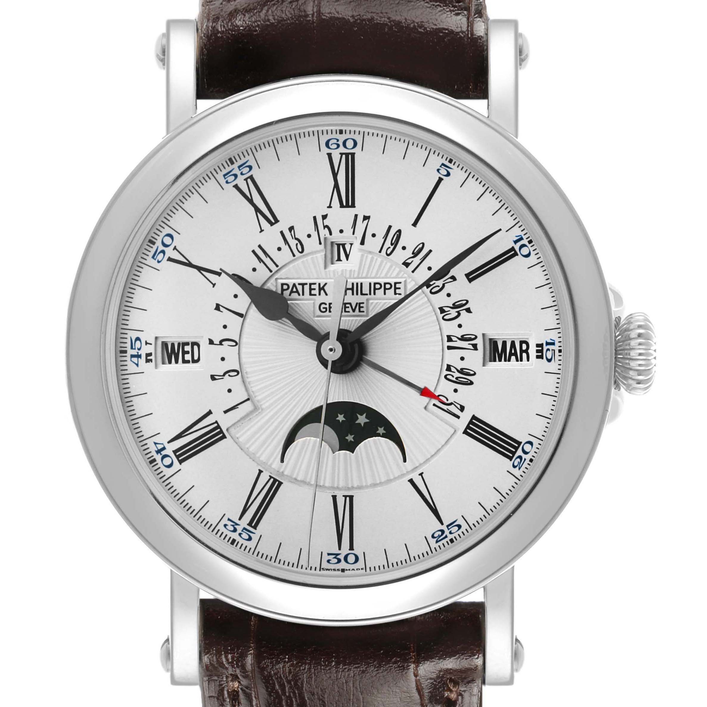 The Patek Philippe Complications 5159G-001 Men's White Gold Silver Dial watch is shown from a front angle, displaying a detailed dial with moon phase and calendar features.
